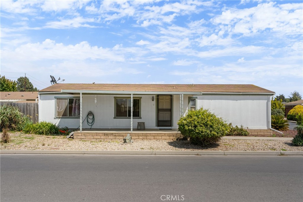 Introducing “Casa del Taylor” – Located in the gated 55+ community of Casa Grande Mobile Estates, this inviting 2-bedroom, 2-bath home combines comfort, functionality, and a low-maintenance lifestyle. The exterior offers a covered front patio, 2-car carport, and easy-care landscaping.
Step inside to a bright living room with a large front window that fills the space with natural light. The layout flows into the dining area and kitchen, where you’ll find plenty of cabinetry, storage, a dishwasher, and additional natural light that creates a bright and welcoming place to gather.
A separate office provides valuable flexibility, complete with wood flooring, built-in cabinetry, and generous storage—perfect for hobbies or a home workspace. The primary suite features an oversized walk-in closet and an attached en-suite with a shower, single vanity, and storage. The second bedroom is comfortable and light-filled, with easy access to the nearby full bath.
As a resident of Casa Grande, you’ll also enjoy access to a variety of amenities, including a clubhouse, pool, spa, golf course, and landscaped common areas. With its convenient location close to shopping, dining, and coastal attractions, this home offers an ideal balance of comfort, community, and lifestyle.
