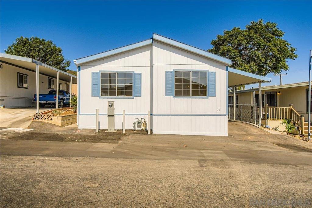 Welcome to this beautifully updated 3-bedroom, 2-bath home offering over 1,200 sq. ft. of well-designed living space in one of Santee’s most desirable all-ages mobile home parks. Step inside to discover soaring vaulted ceilings, new luxury vinyl plank flooring throughout, and fresh interior and exterior paint—giving the home a bright, modern feel. The large open-concept living area flows seamlessly into the kitchen and dining space, creating an inviting atmosphere perfect for everyday living or entertaining. Outside, enjoy an easy-maintenance backyard, a spacious side yard ideal for gardening, and plenty of guest parking nearby. Located in a well-kept, friendly community with a pool and clubhouse, this home also offers incredible convenience—within walking distance to shopping, dining, parks, and popular hiking trails. You're just moments from top-rated schools and have quick access to both the 52 and 125 freeways. With low space rent in a rent-controlled park and close proximity to Santee’s ever-growing retail centers, this well-maintained home is a blank slate ready for a buyer to make it their own. Don’t miss this opportunity to enjoy comfort, style, and convenience in a prime Santee location.
