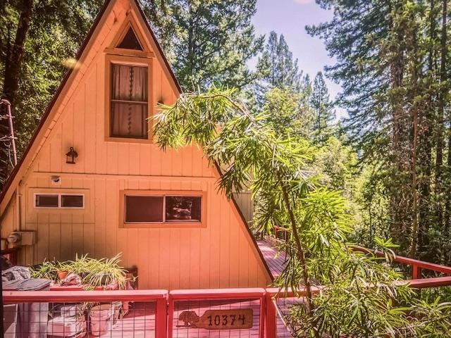 Charming 2-Bedroom Home in the Redwoods, Nestled in the heart of the majestic redwoods, this serene retreat offers the perfect blend of nature and comfort. Bedrooms: 2 Bathrooms: 864 sq. ft. Lot Size: 6011 Sq. Ft. additional 12,893 sq. ft. (adjacent lot included in price) Escape to your own slice of paradise in this charming 2-bedroom home surrounded by towering redwoods. This cozy residence features an open-concept living area that invites natural light. Like a studio downstairs with a loft upstairs. Peaceful sanctuary after a day of outdoor adventures. Step outside to your expansive lot, where you can enjoy the beauty of nature right at your doorstep. With nearly 12,893 square feet of additional land, the possibilities are endless. Imagine a garden, outdoor entertaining space, or even room to build another home or a workshop! Abundant natural light. Surrounded by nature. Close proximity to hiking trails and outdoor activities. Very close to Loch Lomond Lake, fishing kayaking and so much more.Not far from local shops, restaurants, and amenities. Ideal for nature lovers and those seeking a tranquil lifestyle. This unique property is a rare find in a beautiful setting. Don't miss the opportunity to make it yours! Embrace the tranquility of redwood living today!