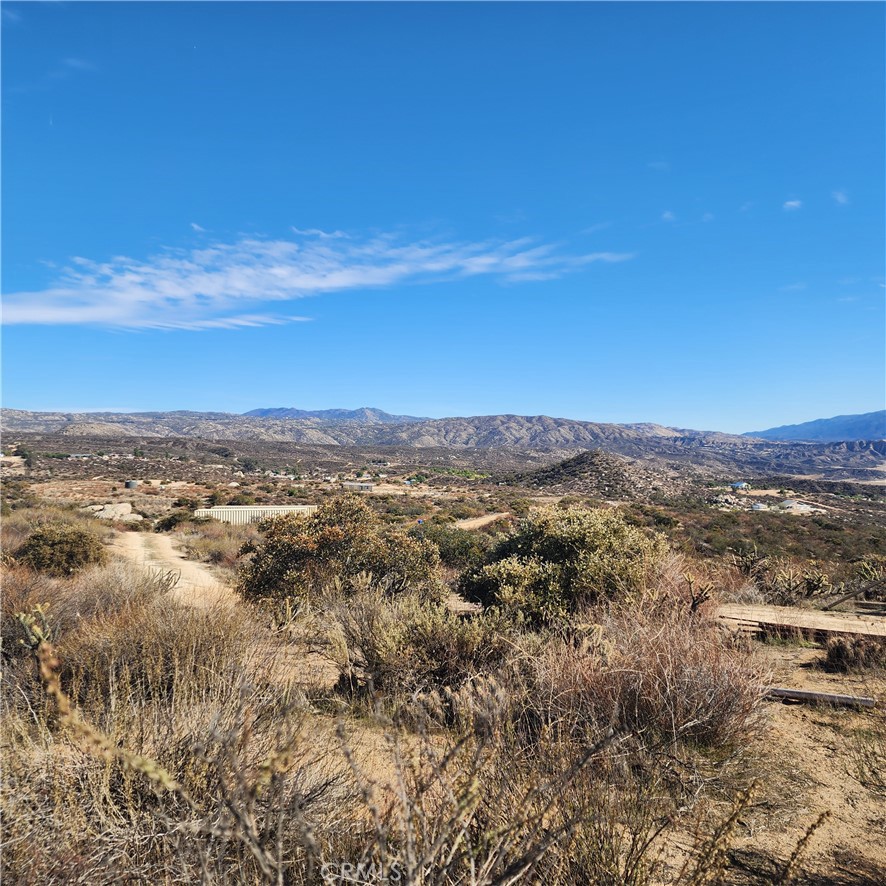 Discover the perfect blend of privacy and natural beauty on this stunning 9.11 acre lot in the serene community of Aguanga,California. Nestled at an elevation of approximately 2500 feet,this secluded paradise offers breathtaking panoramic views of Mount Palomar, Mount Cahuilla and the surrounding mountains. Imagine building your dream home where you can wake up to the awe-inspiring sunrises and enjoy the tranquility of country living at its finest. This expansive property is ideal for animals and all your outdoor activities offering endless possibilities for recreation and relaxation. With plenty of space to grow your crops and fruit trees,vineyards etc. you can embrace a sustainable lifestyle while savoring the beauty of your own private oasis. Conveniently located just 15 minutes from Temecula and it's renowned wineries, you'll enjoy the best of both worlds-peaceful rural living with convenient access to dining,shopping, and entertainment. Whether you're looking to create a family retreat, establish a hobby farm, or simply enjoy the quiet beauty of nature, this lot is a rare find. Don’t miss the opportunity to own this slice of paradise. Contact me today to explore all that this remarkable property has to offer!