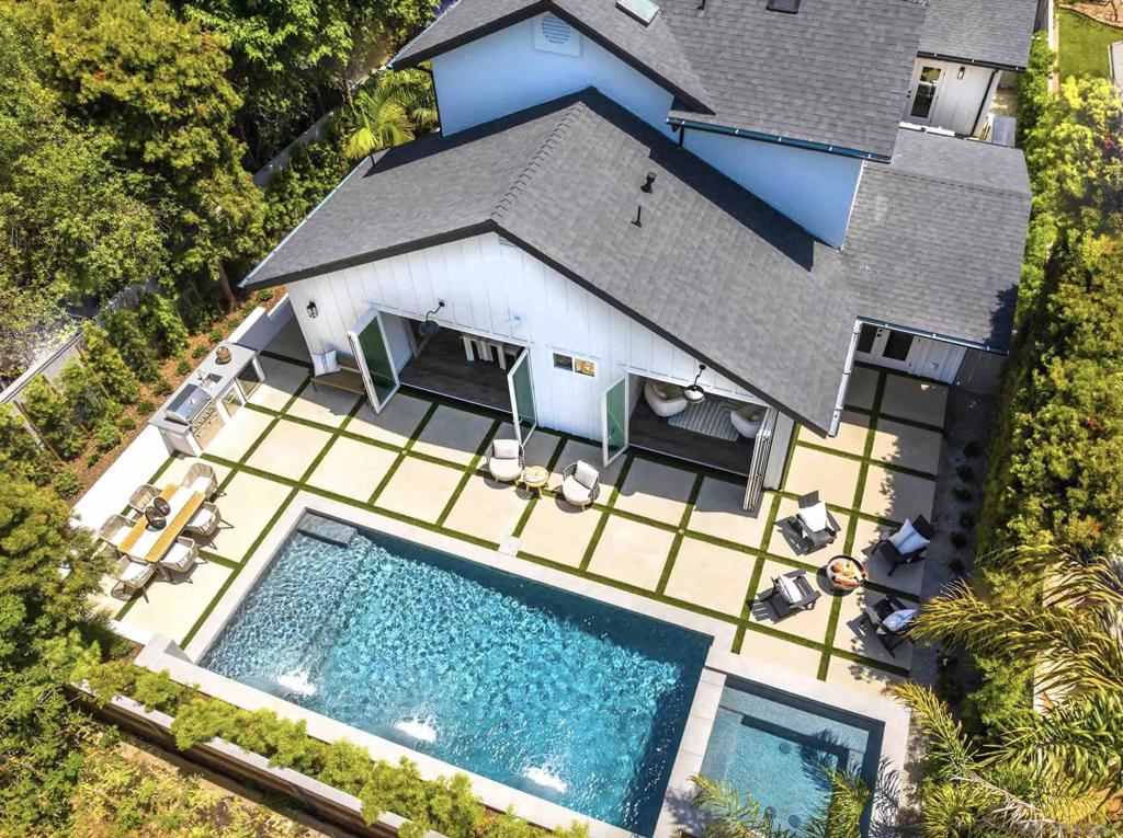 Just Completed... All New Custom Remodel... Coastal Farm House features 4 bedrooms, 4 baths, office, approx 3307 sf plus 3 car garage. Spectacular design with separate office, private courtyard with fireplace, open floor plan with great room, gourmet chef island kitchen, Viking gas range, butlers pantry, breakfast room and formal dining. Luxury Primary suite and Carrara tile bath with custom walk-in closet. Private setting at end of culdesac fully landscaped with pebble tec pool and spa, BBQ, Fountain and custom patios. Original home built 1998....Complete New remodel 2025... gutted to drywall and framing, floor plan reconfigured with new additions... ALL NEW..: roof, skylights, windows, board and batten siding, stucco sand finish, electric, plumbing with tankless water heater and recirculating pump, zoned Heat and AC, low voltage cat 6 wiring, eero whole home wireless router, drywall with smooth skip trowell finish, new interior and exterior doors, bifold cantina style doors, french doors, custom trim and base, new baths with custom carrerra tile, custom kitchin with butler pantry, state of the art appliances, Viking gas range, wine beverage refrigerator, custom closets, mud room with shoe and coat storage, 3 car garage with custom wood doors, epoxy floors and 220V for electric car charging. Smart ring doorbell and security cameras... All new hardscape and landscape including new fence, stucco walls, drip irrigation on timer. new pebble tech pool with sheer descent waterfalls and spa , bbq bar, outdoor shower and fountain. designed for maximum indoor/outdoor resort living.