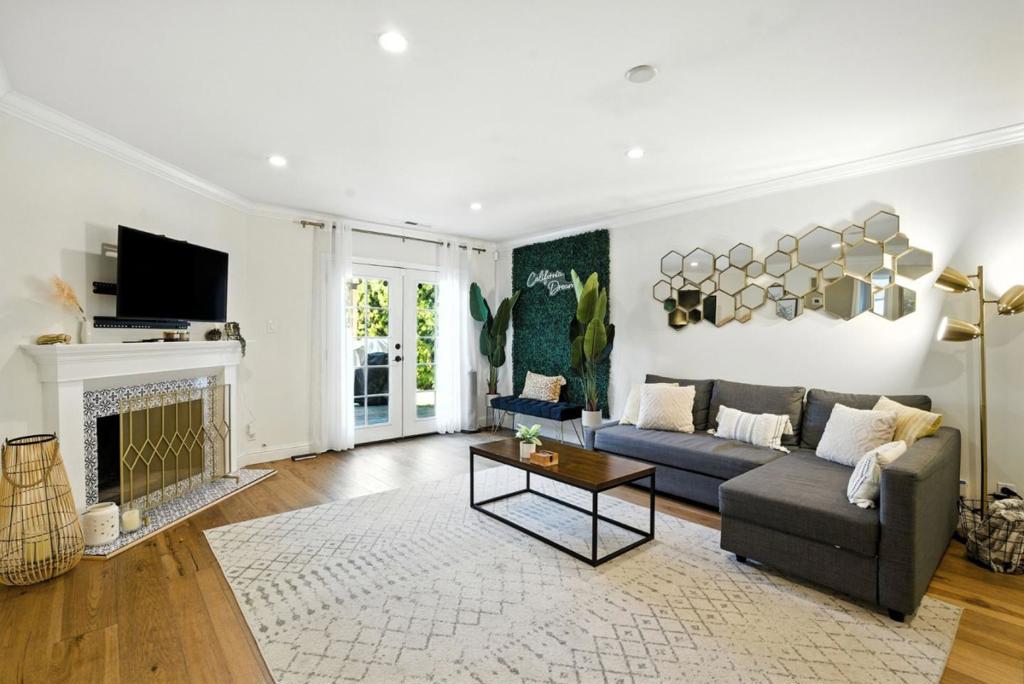Welcome home to this beautifully updated 3 bedroom and 2 bathroom 1-story single family home at the end of a cul-de-sac. This home balances modern comfort with functional living, offering open, inviting spaces designed for both relaxation and entertaining. The open living and dining areas flow seamlessly to the backyard through double glass doors, blending indoor and outdoor living. The gourmet kitchen features white shaker cabinetry, sleek countertops, stainless steel appliances, subway tile backsplash, and bar seating. Retreat back into the serene primary bedroom with an accent wall, large walk in closet, and ensuite bathroom with shower over tub. Down the hallway you can find 2 additional bedrooms and 1 full bathroom featuring a dual sink vanity and shower over tub. 2 car garage for parking and storage along with side by side washer and dryer. The backyard is an outdoor oasis with a spacious deck, pergola with string lights, and tranquil garden. Enjoy the close proximity to Rockridge and Telegraph neighborhoods for foods, shops, and more.