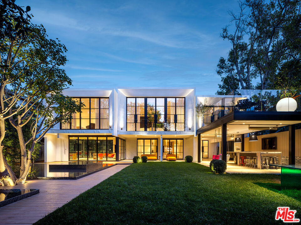 Introducing BEVEL, the next chapter in luxury and leisure. A modern and dynamic project curated with some of the finest finishes and fixtures from around the world, along with a similarly intense focus on balance and function. The homes story is not only one of love, but an inversion from sterility. The performance this property puts on is one of passion, drama, paired with comfort and whimsy. The home is a perfect escape from disarray, all while neighboring some of the most prestigious estates in Beverly Hills. Set behind 7-foot-tall dual gates that open to reveal a roundabout that then lead you to a 10-foot steel and glass pivot door. The property then features French oak floors, gorgeous oversized kitchen, cozy dining, a 26' deck, 2 bedrooms and the owner's suite on the main floor with oversized primary closet and a bathroom with a fireplace all under a retractable ceiling. Leathered Port Laurent accents and Calacatta Viola marble stairs lead you to the property's lower level purposed for entertaining. Presenting a theater, 2 more bedrooms, and a glass-enclosed gym overlooking a 45-foot custom zero-edge infinity pool showcasing a mature Coral tree and lush private yard with an outdoor kitchen. This property by Wilshire Partners is both elegant, & sophisticated. A very rare offering.