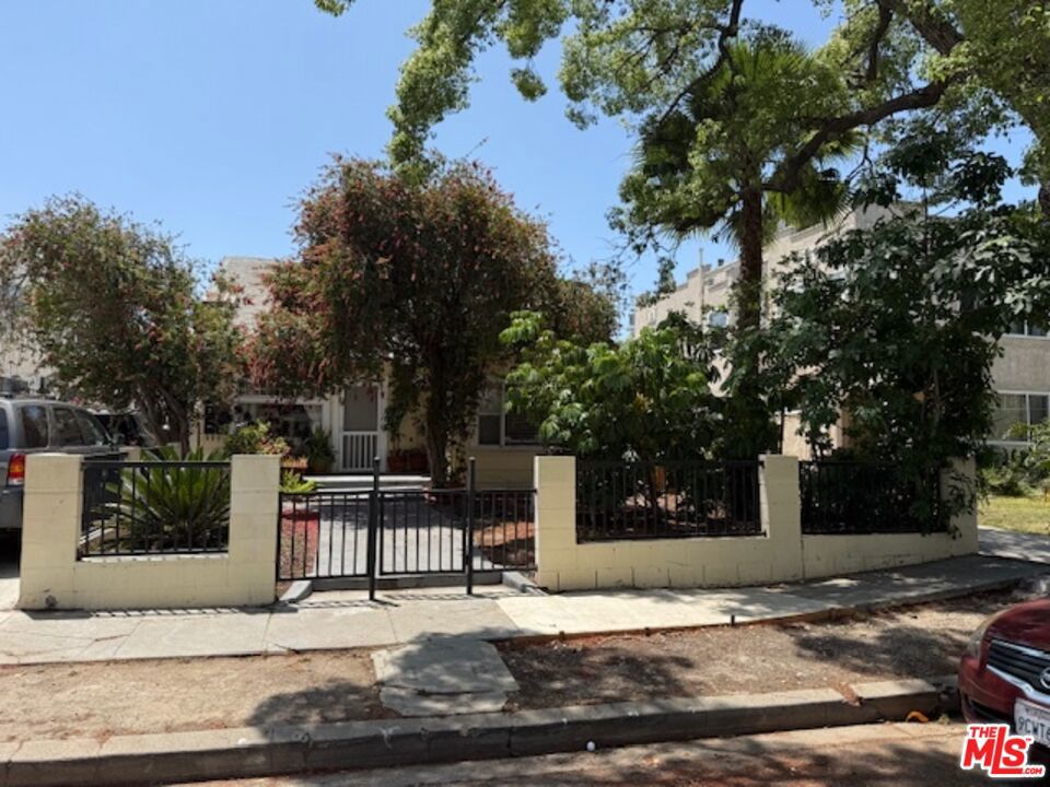 Exceptional investment opportunity in the heart of the Prime Hollywood Redevelopment Area! This centrally located La Mirada property sits within an R3-zoned neighborhood, offering outstanding potential for both investors ,developers and owner-users . The property is comprised of two separate structures: a charming front duplex and a rear two-story triplex.Residents enjoy ample off-street parking, lush gardens, and inviting common areas providing a serene and private atmosphere in a highly desirable urban setting.An ideal opportunity for an owner-user to combine a front or rear unit for personal use while benefiting from additional rental income.Please do not disturb tenants. Income and expenses are estimated, buyers to verify.