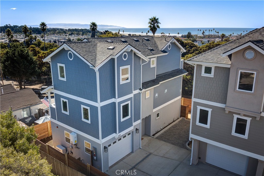 Lording over Pismo Beach California, with the Pacific Ocean just four blocks away, your next-level dream home awaits. Boasting 3 bedrooms and 3 1/2 bathrooms, this turnkey, new construction coastal retreat delivers bold style, effortless luxury and a front row seat to the beach lifestyle! Enjoy a higher standard of Coastal Luxury in Downtown Pismo Beach! This brand new architecturally stunning home offers spectacular ocean views from multiple rooms on the top floor and is perched just four blocks from the crashing waves of the Pacific Ocean. Enjoy being within proximity to the area's finest restaurants, shops and the beautiful Pier. Every detail of this home showcases top-tier craftsmanship with high-end finishes and modern conveniences throughout. This lovely beach home boast Mitsubishi Minisplit AC heating system, Milgard Vinyl Trinsic sound-rated windows, Luxury Vinyl Plank floor, Soft-close cabinets and drawers, Kohler Claxton porcelain bathroom sinks, custom-designed closet systems, Electric Fireplace and Samsung Bespoke appliances. It is additionally equipped with Wayne Dalton insulated quiet garage doors, a generously oversized one-car garage, and an additional private parking space. Crescent elevator w/ integrated phone, Navian tankless water heaters, a pre-wired security and sound system, Photovoltaic Solar Panels and an electric vehicle charger to complete this home’s modern efficiency. There is no HOA on this Single Family beach home. Nestled just off Highway 101 along the beautiful Central Coast of California between Los Angeles and San Francisco, this exceptional property blends elegance and convenience. This is a rare opportunity to own a truly unique home in one of Pismo Beach’s most desirable locations, where coastal charm meets contemporary luxury!
