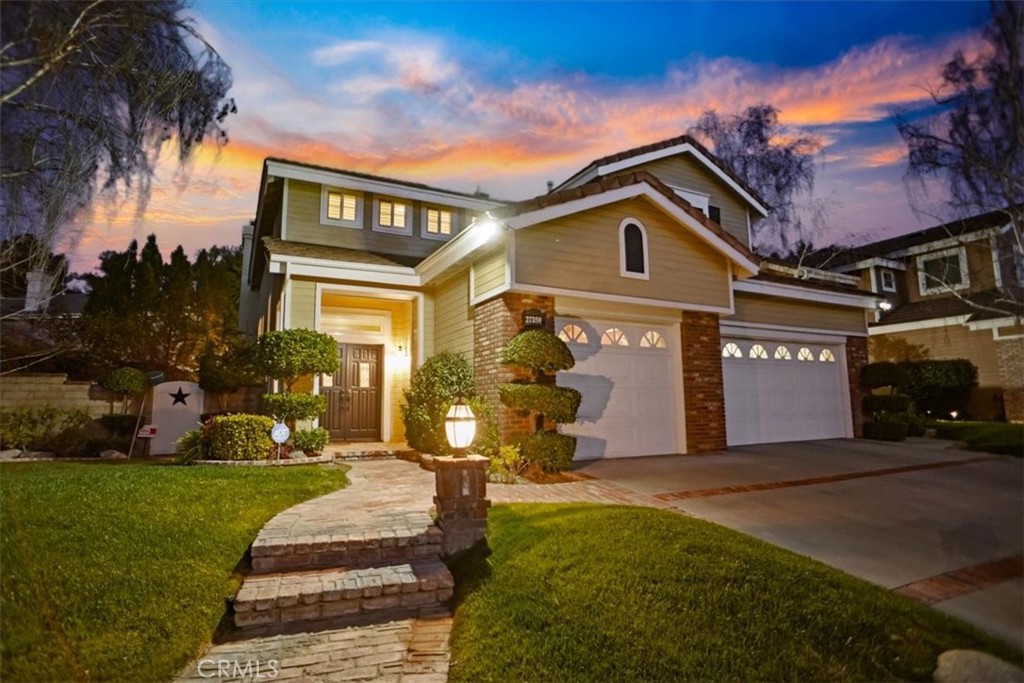 Welcome to your dream home at 27358 Brighton Lane in the desirable Northbridge community of Valencia. This gorgeous 4-bedroom, 3-bathroom residence offers an impressive 2,612 square feet of living space, perfectly situated on a generous tree-lined 7,984 square foot lot.
As you walk in you are greeted by soaring ceilings and a modern banister, showcasing the loft office upstairs. The flooring has been upgraded and is hard surface throughout. The remodeled kitchen offers white cabinetry, large pantry, stainless appliances, and a kitchen nook. The family room provides built-ins and a cozy fireplace. There is a separate formal living room and dining room for all of your entertaining needs.
The DOWNSTAIRS primary suite is a rare convenience, providing a private retreat with walk-in closets, luxurious bath and access to your backyard sanctuary. Upstairs, you will find three additional bedrooms, along with a versatile office loft space, ideal for working from home or pursuing creative passions.
Outside, enjoy the California sunshine in your own backyard oasis, complete with a private pool and spa, perfect for relaxation and fun-filled gatherings. You’ll love hosting summer barbecues in the dedicated barbecue area. Completing this stunning home is a 3-car garage and solar! Low HOA and No Mello-Roos!
For sports enthusiasts, the community offers access to a playground, paseos, clubhouse, pool/spa, tennis court, and more, ensuring there’s always something to do.
Come experience the perfect blend of comfort, style, and community in this exceptional Valencia home. Schedule a showing today and make 27358 Brighton Lane your new address!