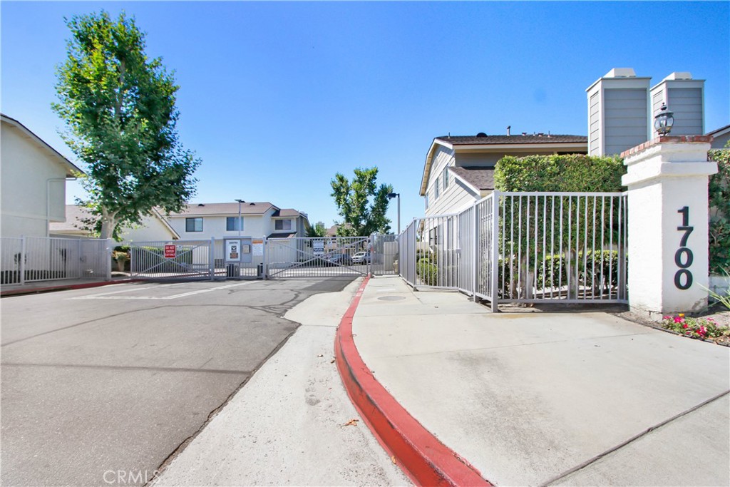 Move-in ready 3-bedroom, 2.5-bathroom end-unit townhome located in the desirable gated Saratoga Community in Anaheim. This bright and inviting home offers a private front patio, open-concept family room and kitchen with stainless steel appliances, dual-pane windows, recessed lighting, and luxury vinyl flooring throughout. The primary suite features 2 closets and a cozy nook perfect for a home office or extended space. Two additional bedrooms offer flexibility for kids, guests, or an office. Bathrooms include a walk-in shower and a tub/shower combo for added convenience. Enjoy direct access to a 2-car garage with overhead storage plus smart home upgrades including a Nest thermostat, Ring doorbell, and WiFi enabled garage opener. The HOA provides water, trash, community pool/spa and exterior maintenance. The location offers easy access to shopping, restaurants, freeways, and nearby attractions like Disneyland, Angel Stadium, Honda Center, and Anaheim Packing District and more. This move-in ready home combines comfort, convenience, and an excellent location — perfect as your next place to call home!