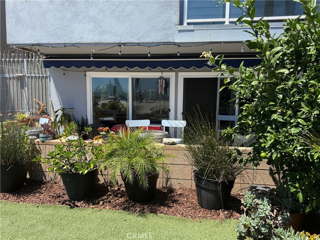 Once in a lifetime opportunity to live and play right on the sand of Alamitos Beach. There are only a few condos like this where the sand is your front yard. Live large and live in nature, this is the beach pad of your dreams. The 2 bedroom, 2 bath unit fis fully remodeled, looking coastal and giving that relaxed beachy feel you want to live a stress-free life. The open kitchen is opens up to the dining room/ living room which is great for entertaining. But, you won't entertain inside for long as the two sets of sliding glass doors open up to your private beach-side patio. Here's just the beginning of your oasis as just beyond the patio is the sand. The owner has curated a great garden and living space out there with flowers, lush palms, veggies (tomatoes, chiles, basil, aloe and others) and the artificial turf just waiting for your customization - table, chairs, hammock, smokeless fire pit , and whatever else it takes to live your new home/vacation life. You are walking distance to both Gaucho Grill and the Saltwater Deck. Walk to Yoga on the Bluff for daily free yoga and meet your neighbors. Farmers markets is across from yoga on Tuesdays and Saturdays. And make sure you visit the inflatable obstacle coars on water right in view from your patio. You can set up a volleyball net in the sand right in front of your house. You can walk to museums, coffee shops, restaurants and the HiLo wine bar. And new options are opening up all the time. To top it off, it's quiet here. You don't get all the noise you get living just 4 blocks away either at Alamitos Beach or Junipero Beach where you heare four different songs playing at once. There is not a public parking lot in the immediate vicinity so that means it's peaceful and tranquil. And, the hours and hours of people watching with the bike and pedistrian bike path is clear view from your patio is priceless. Included is one assigned gated parking spot. Take this opportunity to live the extraordinary life that you deserve. The beach awaits!