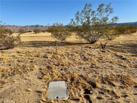 Photo of 65115 Sun Mesa Road, Joshua Tree, CA 92252 (MLS # JT26118388)