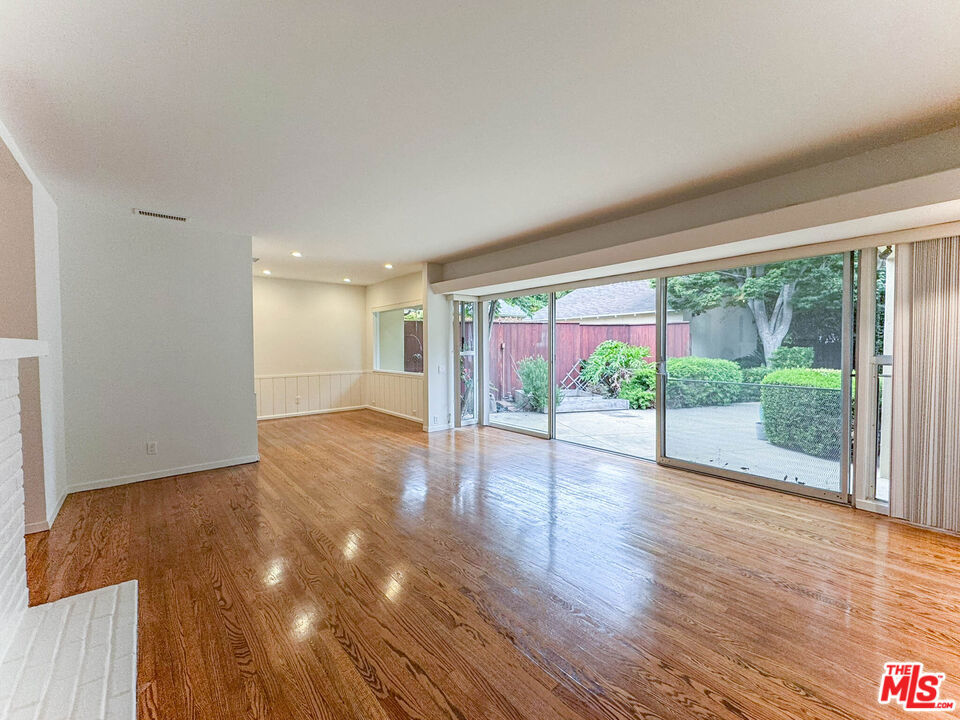 Mar Vista Neighborhood - 3BD/2BA + Office & Converted Garage Beautifully updated residence that perfectly blends comfort, functionality, and style. Featuring a versatile bonus office space and a thoughtfully converted garage, this home offers exceptional flexibility to suit your lifestyle. Enjoy the spacious, light-filled living area highlighted by wood burning fireplace, expansive wall-to-wall windows and a sliding glass door that invites natural sunlight throughout the day. The fully equipped kitchen includes a stove, dishwasher and refrigerator, with a dedicated laundry area featuring side-by-side washer and dryer units for added convenience. Outside, a large private deck sets the stage for unforgettable outdoor gatherings. A roomy driveway provides ample parking for residents and guests alike. Central Air & heat, no pets allowed, tenant pays all utilities except gardening service.