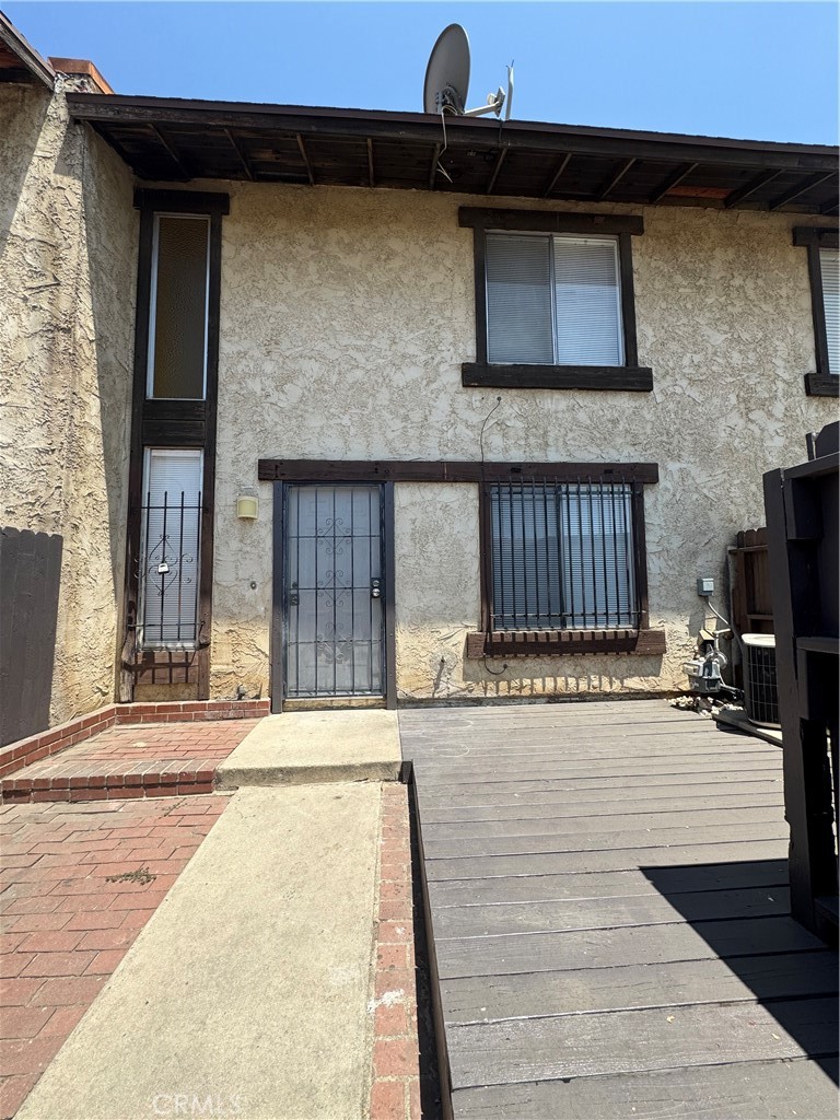 Calling all first time buyers or investors! This move-in ready, light and bright condominium is the one you've been waiting for! It offers 1,168 sq,ft. of living space, two bedrooms, one and a half baths and a detached carport. Updates include vinyl flooring throughout, ceramic tiles in bathrooms and in laundry room, freshly painted interior walls and window blinds. Enjoy the privacy of a fenced in spacious courtyard and a cozy backyard. The main floor features an airy living room, dining area, a half bath, kitchen, and laundry room. The second floor offers the primary bedroom with double door entry and large closet, second bedroom and one full bath. Affordable and conveniently located near freeways, Costco and Sam's Club, plus a short drive to Cal-State San Bernardino and Loma Linda University. Don't wait, schedule a tour today!