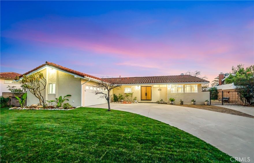 Turnkey, fully remodeled single-story West Hills residence offering 4 bedrooms, 3 designer bathrooms, and magnificent panoramic views that define the home’s appeal. This property combines modern design with an elevated setting, creating a rare blend of privacy, light, and outlook.

A gated front entry leads to an oversized driveway and finished two-car garage with epoxy flooring and recessed lighting. Inside, wide-plank wood floors, recessed lighting, and a bright neutral palette set a refined tone. Vaulted ceilings with exposed beams and expansive picture windows draw the eye outward, flooding the living spaces with natural light while showcasing open hillside and valley views.

The chef’s kitchen is designed for both function and entertaining, featuring custom white shaker cabinetry, quartz countertops with full backsplash, stainless steel appliances, a gas range, a built-in microwave, a farmhouse sink, and a large center island. A dedicated laundry area with built-in cabinetry is seamlessly integrated.

The primary suite is a private retreat positioned to enjoy the views, offering generous space, abundant light, and a spa-inspired en-suite bathroom with floating wood vanity, quartz counters, designer fixtures, soaking tub, frameless glass, and refined tilework. Secondary bedrooms are spacious and bright, while additional bathrooms continue the cohesive modern aesthetic with walk-in showers and contemporary finishes.

The backyard is perfectly oriented to take in the unobstructed views, featuring new fencing, a manicured lawn, and flexible space for entertaining, relaxation, or future customization. The indoor-outdoor flow makes the view a constant backdrop to daily living.

Additional highlights include:

New windows and doors throughout

Updated electrical, plumbing, and HVAC

Recessed lighting and modern fixtures

New interior doors and hardware

Finished garage and gated entry

Ideally located near parks, schools, shopping, and dining, this move-in-ready home delivers spectacular views, modern upgrades, and exceptional single-story living in a highly desirable West Hills neighborhood. Virtually staged.