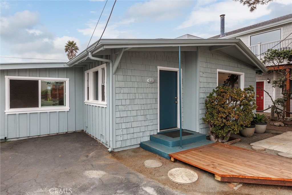 Morro Bay Classic Cottage Home! This super cute home offers more than meets the eye. Nicely refreshed with only one owner for over 30yrs, you can take on the next few decades. ( Driveway is being improved! ) The open and central living area offers vaulted wood ceilings, a boutique kitchen area, and a charming wood fireplace w/heatilator. New Interior and Exterior paint throughout. New flooring, fixtures and love. There are two bedrooms in the rear of the home, each with vaulted ceilings as well as a very spacious room on the westside of the home. This is a flexible use space as suited. Beyond it is the laundry area and door to the exterior. The back yard is fenced and a blank canvas to create. The way the home is situated you have the feeling of space. The front area has a prepped area, great for a firepit zone or additional parking. The A small redwood lined deck was replaced at the entrance, creating an opportunity for a cottagey fenced area with outdoor table to get some morning sun that filters thru the trees...enticing. Located in Central North Morro Bay within walking or biking to the Beach, Pickleball courts, dog park and joyful neighborly strolls. Grab yourself an adorable Beach Cottage to "chill out" in Morro Bay while the inland swelters all summer.