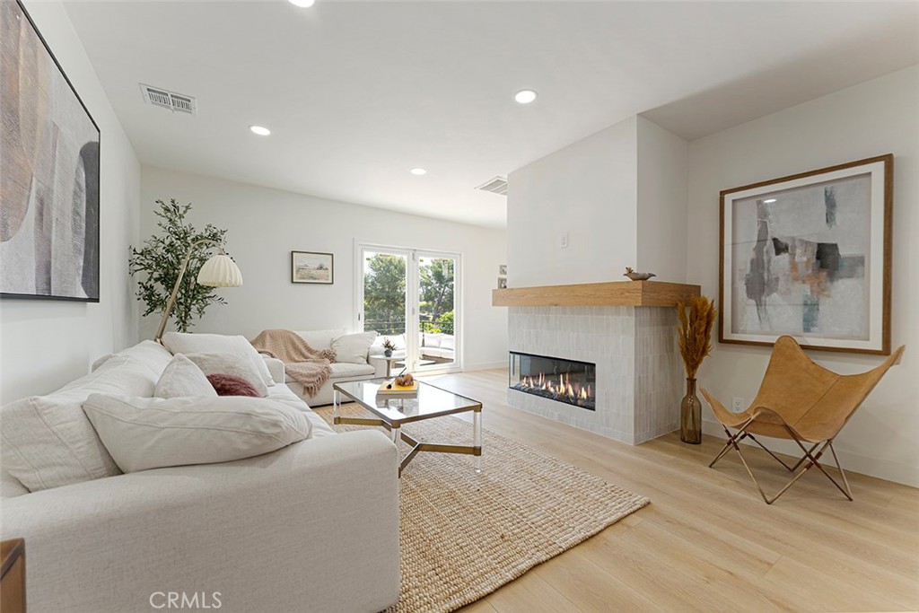 Perched with poise in the hills of Mount Washington, this beautifully updated 2 Bedroom, 1.5 bath single-level residence boasting 1410 sq ft—complete with a detached 218 sq ft bonus room perfect for a home office, art studio, or serene yoga retreat—offers the perfect blend of charm and modern refinement. Step into a warm and inviting foyer with abundant built-in storage that immediately sets the tone for the thoughtfully designed interiors. The sun-drenched living room features a stylish fireplace and seamlessly connects to the dining area, where sliding glass doors frame panoramic views—creating an ideal setting for entertaining or simply unwinding in nature’s embrace. The kitchen is a showstopper, boasting Shaker cabinetry, designer hardware, custom tile backsplash, and stainless-steel appliances—perfectly balancing beauty and functionality. Throughout the home, new flooring, recessed lighting, and sleek contemporary finishes elevate the airy, open-concept layout. Step outside to an expansive rear patio—an idyllic space for al fresco dining, evening cocktails, or soaking up the golden-hour glow over the canyon. Both spacious bedrooms offer peaceful privacy, making this home a true retreat from the city buzz. Situated on a tranquil street in one of Northeast LA’s most coveted enclaves, you're just moments away from the acclaimed Mt. Washington Elementary School, scenic parks, cultural gems, and vibrant local dining.