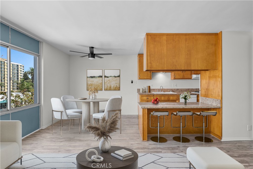 Location, location, location! Don’t miss this incredible rare opportunity to own a mid-century modern top-floor unit in the Linden Tower located in the heart of the East Village Arts District in Downtown Long Beach. This rarely available residence offers the best of urban coastal living in one of the city’s most vibrant and walkable neighborhoods—just minutes from the Marina and the beach. This bright and airy vintage 1-bedroom, 1-bath home features a spacious living and dining area, ample closet and storage space, and large windows that fill the unit with natural sunlight. Almost every room offers views of city lights and Signal Hill. The kitchen is appointed with granite countertops, vintage maple cabinetry, and includes a dishwasher, built-in oven, stovetop range, and refrigerator. The secure building offers a stylish lobby with controlled access and convenient on-site laundry facilities. Located within walking distance to restaurants, cafes, grocery stores, shopping, the Metro, parks, the Convention Center, Performing Arts Center, Shoreline Village, The Pike, the Aquarium of the Pacific, and the beach, this home places you in the heart of it all. The East Village is known for its rich arts and culture, with frequent events and festivals that create a true sense of community. Whether you're looking for an active lifestyle, a creative environment, or simply want to enjoy everything Downtown Long Beach has to offer, this home delivers it all. Experience the best of urban living. NOTE: Some images have been virtually staged to showcase the potential of the property.