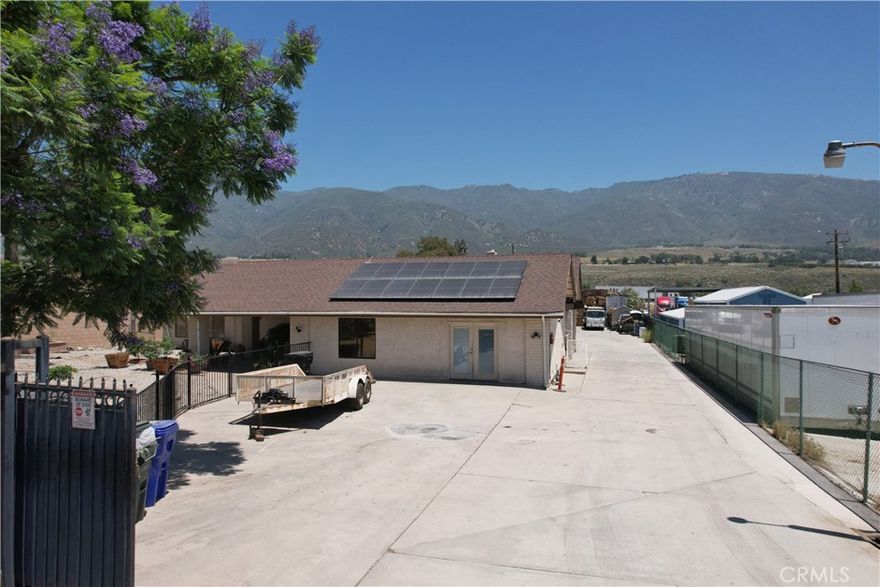 Unlock the potential of 18900 Cajon Blvd, a 1-acre light industrial parcel ideally located along the I-215 corridor in San Bernardino. Zoned Corridor Industrial (CI), this property supports a wide range of commercial and industrial uses—from warehousing and distribution to manufacturing, R&D, and professional services.  The site features a 3,000 sq ft residential structure with 5 bedrooms, office space with 8-car garage capacity, central HVAC, and a flexible layout ideal for owner-users or investors. With direct freeway visibility, it offers unmatched exposure and access to I-15 and I-210 via the nearby Devore Interchange, million dollar infrastructure upgrade that has transformed the area into a logistics powerhouse.  Located within the Glen Helen Specific Plan, the property is surrounded by new residential developments, a major FedEx complex, and a growing business park. Making this a rare opportunity in a high-growth industrial corridor.