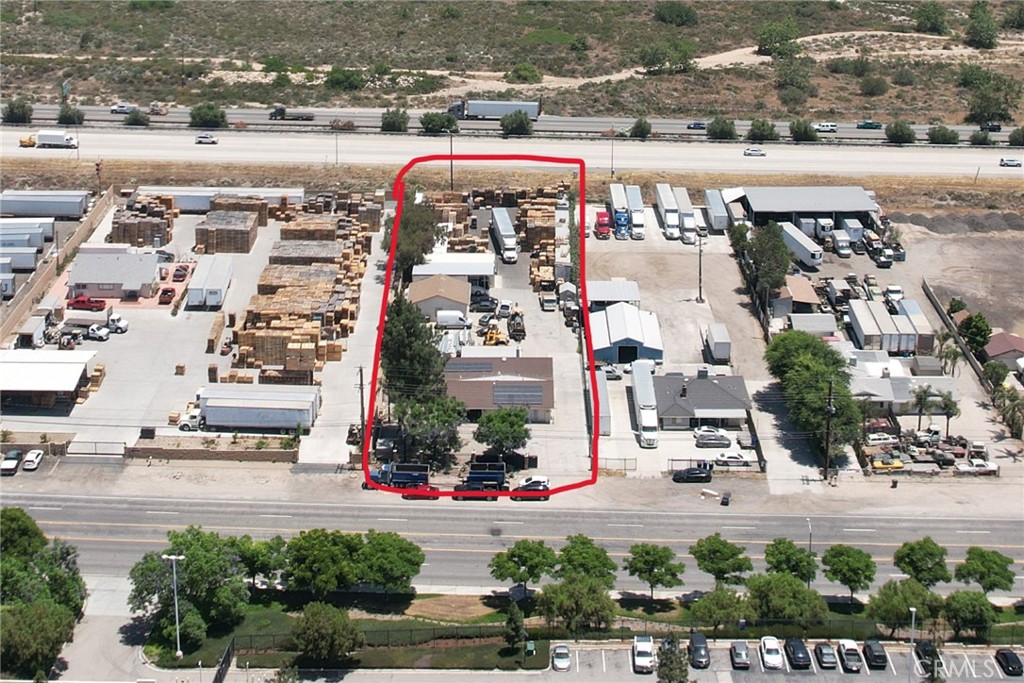 Unlock the potential of 18900 Cajon Blvd, a 1-acre light industrial parcel ideally located along the I-215 corridor in San Bernardino. Zoned Corridor Industrial (CI), this property supports a wide range of commercial and industrial uses—from warehousing and distribution to manufacturing, R&D, and professional services. The site features a 3,000 sq ft residential structure with 5 bedrooms, office space with 8-car garage capacity, central HVAC, and a flexible layout ideal for owner-users or investors. With direct freeway visibility, it offers unmatched exposure and access to I-15 and I-210 via the nearby Devore Interchange, million dollar infrastructure upgrade that has transformed the area into a logistics powerhouse. Located within the Glen Helen Specific Plan, the property is surrounded by new residential developments, a major FedEx complex, and a growing business park. Making this a rare opportunity in a high-growth industrial corridor.
