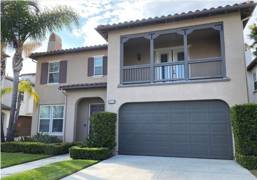 Welcome to this stunning 3-bedroom, 2.5-bathroom single-family residence located inside the exclusive gates of BelAir in Huntington Beach. Offering approximately 2,457 sq ft of living space, this home includes a spacious third-floor loft/bonus room and an attached 2-car garage with an epoxy-coated floor and private driveway.  Upon entry, you'll find a welcoming living room with a cozy fireplace, and just past the staircase is a convenient powder room. The updated kitchen features granite countertops, stainless steel appliances including a cooktop, double oven, microwave, and dishwasher, along with a double-sized island that opens seamlessly to the family room — complete with a built-in entertainment center and ample storage.  Step outside to the expansive back courtyard, ideal for relaxing or entertaining. It features a built-in fireplace and fountain, providing a private and serene outdoor space.  Upstairs, you’ll find all three bedrooms and the laundry room. The primary suite offers a jetted soaking tub, dual vanities, and a separate walk-in shower. The secondary bedrooms are connected by a Jack & Jill bathroom, with one bedroom offering access to a private balcony. Throughout the home, you’ll find attractive wood-look laminate flooring.  Additional features include central air conditioning (AC) for year-round comfort.  Though the home shares a common wall at the rear with the neighboring property, it lives like a detached home with generous private outdoor space.  Enjoy access to the community pool and spa, as well as proximity to Peter Green Park, just outside the gates, featuring a playground and open green space. Conveniently located within biking distance to the beach, Pacific City, Main Street, Five Points Shopping Center, SeaCliff Village, and more!