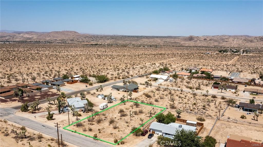 Build-Ready Joshua Tree Lot – Water Meter Installed, Address Assigned, North-Facing Views. This ~0.41-acre parcel in Joshua Tree offers a rare combination of convenience, views, and build potential. The lot features a generous building envelope with unobstructed north-facing views, and while there are a few Joshua trees on the property, they are well outside the optimal building area, allowing for construction without environmental delays. The property is development-ready with a paid water meter, assigned address, and no need to wait for time-consuming utility approvals. Plans for a 3-bedroom, 2-bathroom, 1,300 sq ft home are available upon request, giving buyers a head start toward their desert retreat or investment build. A percolation test and soils report are also available. Go direct and walk the site to experience its potential firsthand.