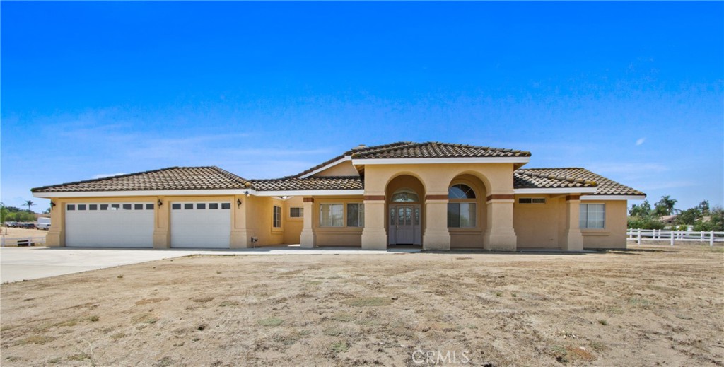 Opportunity knocks with this single-story home on almost 2.5 acres. This property features 3 bedrooms, 2.5 baths, 1911 sf. Inside you will find a Bright and Airy Floorplan. The Living Room is Designed with High Vaulted ceilings plus a Stone Fireplace that leads you to the Separate Dining Room. The Open Kitchen offers Breakfast Bar and Breakfast Nook plus Ample cabinetry, New Dishwasher and Walk-in Pantry.
Large Primary Bedroom with En Suite Bathroom, Walk in Closet, Dual Sinks, Separate Shower and Soaking Tub. The add’l Secondary Bedrooms are both good sized with an Adjoining Full Bath. Add’l Half Bath near Indoor Laundry Room. Wood Flooring throughout. Recessed Lighting. Extra Storage Space with both a Hall Closet and Linen Closet. Newer AC unit, New Water Heater and Tesla Solar to help reduce those utility bills. 3 Car Garage with New Garage Door. The Backyard is Fully Fenced and a blank canvas to make your own. Need room for your Horses, Looking to Build an ADU, Barn/Workshop, or Need space for those Toys/RV? The possibilities are endless. Located among horse properties with NO HOA, and trails throughout the community, this home is ready for your personal touches.