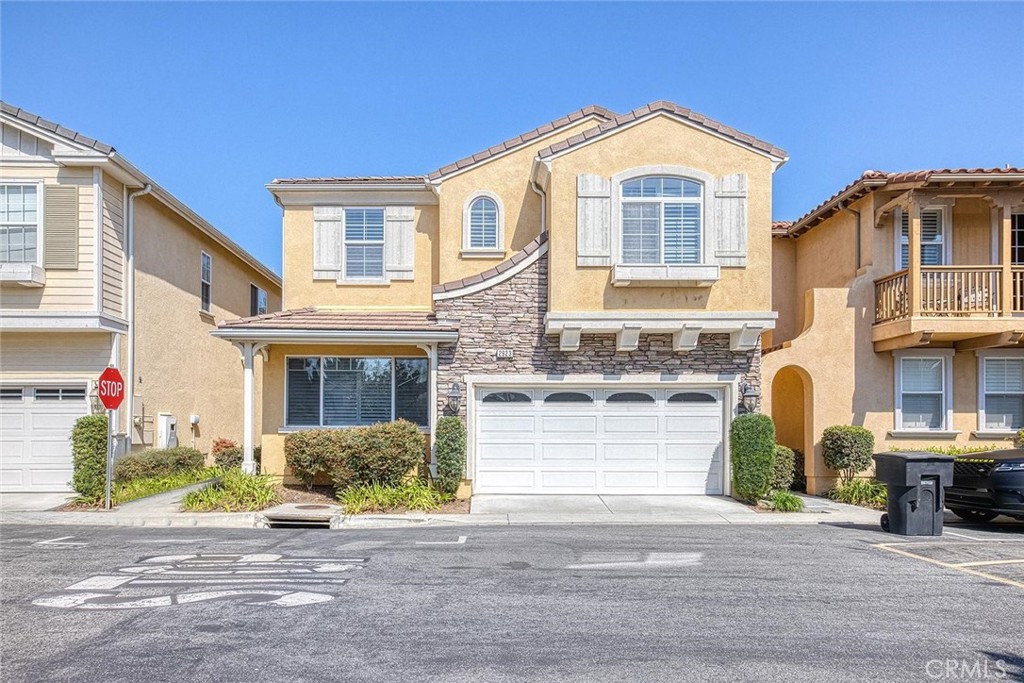 Welcome to BELMAR, highly sought after gated community in Torrance! This beautiful two story detached home offers 4 bedrooms plus den and 3 bathrooms at 2,535 square feet of living space. Upon entering the home, you'll be greeted with a spacious & bright living room, family room with a dual fireplace and open layout gourmet kitchen with granite countertop, large pantry, stainless steel appliances and breakfast island. A spacious office/Den and a full bathroom on the main floor. Second floor includes a master suite with two separate vanities and a huge walk-in custom closet, three large bedrooms with ample closet space, a full bathroom and laundry room. This home boasts its well maintained private backyard, hardwood/travertine flooring, central AC/heating system, plantation shutters and recessed lighting. Two car attached garage with direct access and additional assigned parking space in the front. Plenty of guest parkings in the community as well. Enjoy the community pool & spa with bathrooms & showers and B.B.Q pits. The BELMAR is conveniently located near the Del Amo Mall, which is the largest shopping center in the western United States. Also nearby are markets, amazing restaurants, prestigious schools, parks and beaches. Refrigerator and water filter included without warranty.