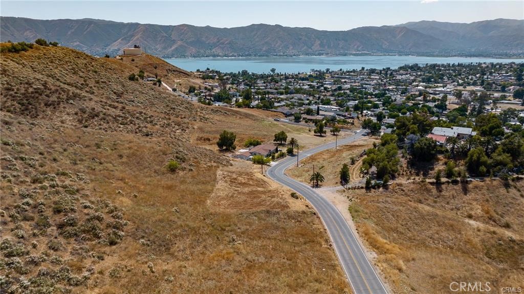 ** Prime Development Opportunity with Stunning Views in Lake Elsinore **
Discover the perfect blend of location and potential with this rare offering in Lake Elsinore. This property consists of three adjacent parcels, collectively spanning 25,701 square feet, providing ample space for your vision to come to life.
Nestled in a serene setting, this lot offers breathtaking views of Lake Elsinore and the surrounding mountains, creating an idyllic backdrop for a dream home or investment project. Convenience is key, as the property is situated just 2.7 miles from the nearest Costco shopping center, ensuring easy access to everyday essentials. For recreation enthusiasts, the Launch Pointe Recreation Destination and RV Park is only 3.9 miles away, offering endless opportunities for boating, camping, and relaxation.
Over half an acre of land with views of the lake. **This property includes site plans, structural and engineering plans along with soil reports and a land survey**
Don’t miss this chance to own a piece of Lake Elsinore’s beauty, where stunning scenery meets unbeatable location. Explore the possibilities today!