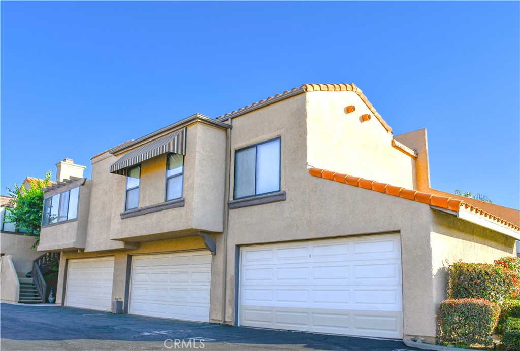 Welcome to the Via Valencia complex! It is conveniently located blocks away from shops, churches, the Brea Mall and downtown Brea. Discover this beautifully updated spacious condominium floor plan. This home boasts newly painted interiors and kitchen, elegant-recessed lighting, a modern chandelier, and resilient hybrid hardwood flooring throughout the living room and bedrooms.
Enjoy the approximately 1002 SQFT open flow layout with high ceilings, a cozy gas-powered fireplace, and a generous private balcony terrace. The master bedroom suite features high ceilings, 2 closets - a mirrored and walk-in closet, and its own full bath. The second bedroom includes a built-in shelving and a mirrored closet, providing storage and space. Additionally, the in-unit laundry hookups add everyday ease and convenience. A 2-car garage is located right underneath the unit, with the potential for EV charging conversion subject to HOA approval. Private amenities, including a pool and spa are accessible to residents of this well-maintained community. This lovely condo is a must see!