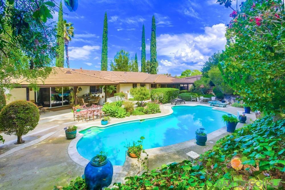 Beautiful custom-built home with a lot of character and charm. Over half an acre lot with mature trees and landscaping. Your own lush private home in the middle of Poway. A sparkling swimming pool awaits those warm sunny days. Walk into this home and you are greeted with a center waterfall feature. This home features dual master bedrooms with ensuite bathrooms. Large walk-in closet with custom built ins. A sunken bathtub that overlooks an outside garden also awaits you. There is a separate family room and living room for all those family gatherings. An additional great room that could be used for a playroom or art studio. Cozy office area.