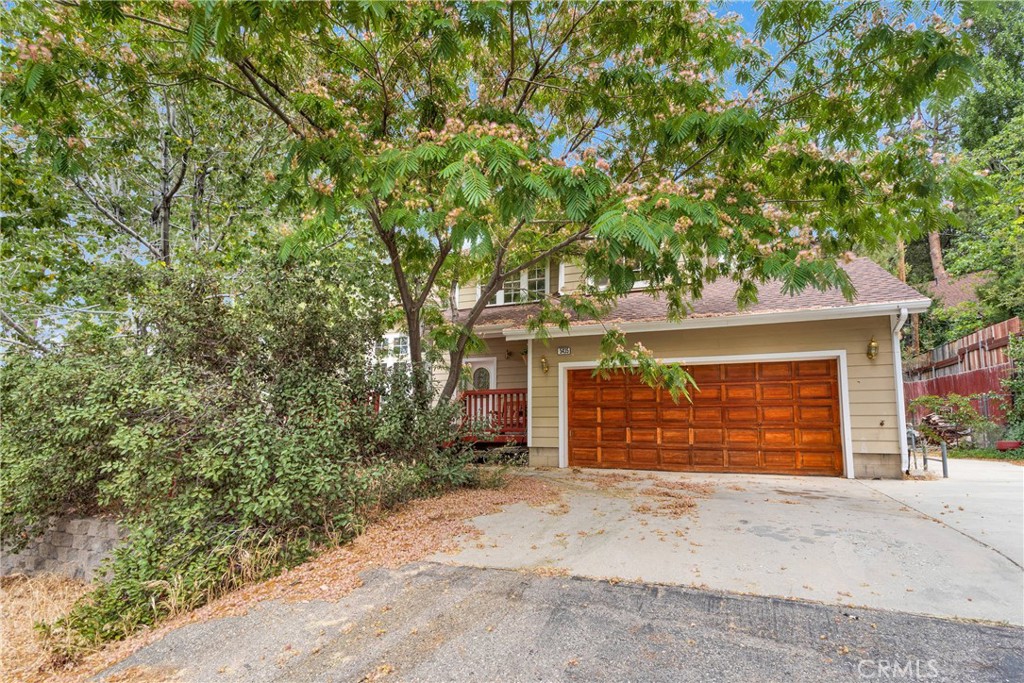 Come enjoy all Wrightwood has to offer! New roof installed in 2021 and it has central AC! Located on a cul-de-sac AND a large lot, there is so much to appreciate here. Imagine drinking your cup of morning coffee on the front deck, or sitting here to unwind after a day of work. PLUS the back deck! Perfect for when you want to enjoy your privacy. Entering the home you will love the tall ceilings and windows that let in natural light and the beautiful brick fireplace. The kitchen is open to the dining room and has bar seating at the counter, giving you plenty of space for hosting. The floor plan is really great giving you a guest bathroom & office (or 4th bedroom) down stairs and an in door laundry room. Aside from the garage there's a separate storage shed with a secondary driveway giving you even more space for parking! While this home is totally functional as it is, it's also perfect for someone who wants to do upgrades their own way