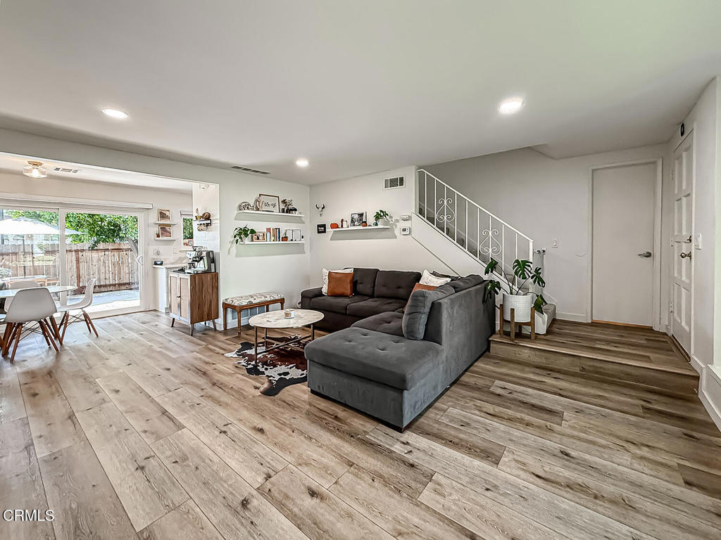 Stylish Remodeled End-Unit Townhome with 2 separate Private Garages & Outdoor Retreat. HOA dues include water, sewer, trash and insurance (buyer to verify)Welcome to this beautifully upgraded 3-bedroom, 2-bathroom end-unit townhome, perfectly situated near Moorpark College, shopping, dining, and convenient freeway access. Offering the feel of a detached home with no neighbors above or below, this rare property combines modern comfort with low-maintenance living.Step inside to find a thoughtfully updated interior featuring brand-new windows and sliders, newer vinyl plank flooring, fresh wall texture and paint, and a light-filled open-concept layout. The remodeled kitchen with newer appliances flows seamlessly into the living and dining areas, while updated bathroom vanities add a stylish touch.Enjoy the ease of 2 private garages. Includes direct-access garage (not shared), plus an additional private detached garage--rare in this community. The garage includes extra storage or the flexibility for a home gym or workshop.Outdoors, the spacious private patio is enhanced by a mature orange tree, creating the perfect space to relax or entertain. With its modern upgrades, turnkey condition, and unique combination of privacy and functionality, this home is truly a standout.Don't miss your chance to own this exceptional property--schedule a showing today!