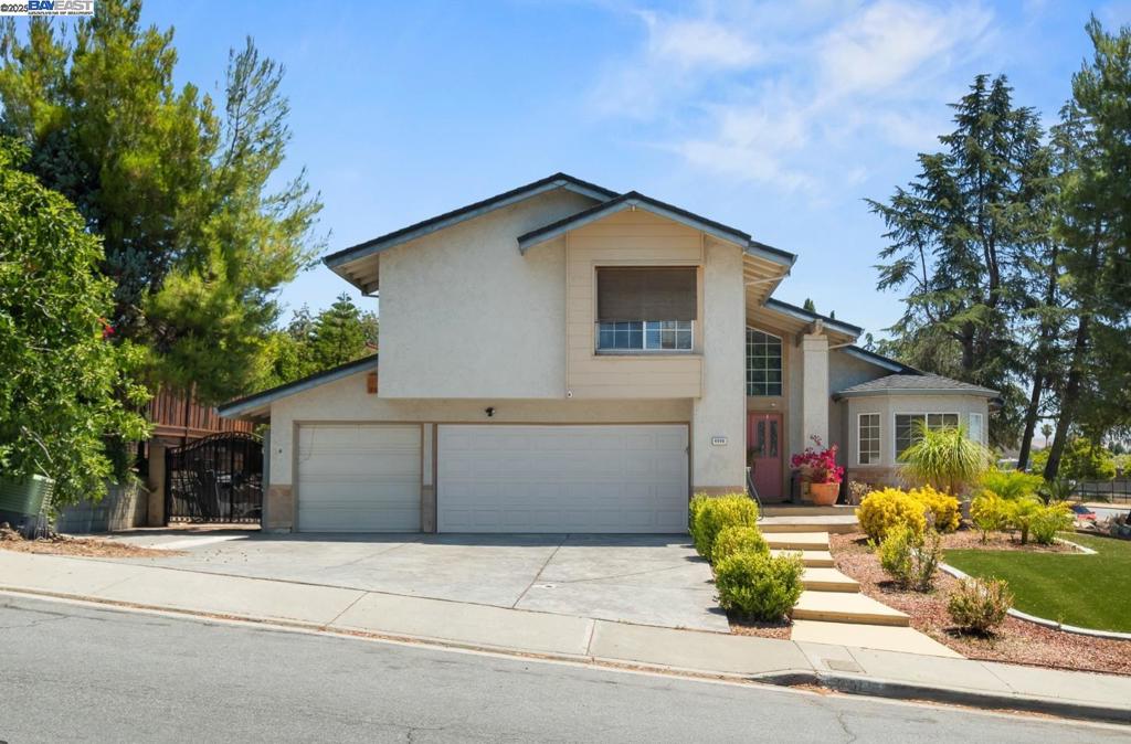 Welcome to this beautifully maintained and nicely upgraded home, hitting the market for the first time this century! Situated on a spacious corner lot, this stunning property offers exceptional curb appeal, complete with an inviting floorplan and a charming front entryway. Step inside and enjoy a warm, inviting layout featuring high ceilings and an open-concept living area perfect for entertaining. The living room showcases custom tile work, elegant fixtures, and large windows that flood the space with natural light. The kitchen is a chef’s delight, boasting hardwood floors and stainless steel appliances. Whether you're preparing a family meal or hosting a dinner party, this space is both functional and stylish. Retreat to the serene master suite with its private sitting area—ideal for reading or relaxing. Bathrooms have are upgraded with quality tile work and tasteful finishes throughout. There are 4 bedrooms and 2 bathrooms upstairs. The bottom floor has 1 full bath and a bonus room that is being used as an additional 1 bedroom. Set in a desirable neighborhood, this home offers both comfort and convenience, with space to grow and entertain indoors and out. Don’t miss your chance to own this rare, well-cared-for property—schedule your private tour today!