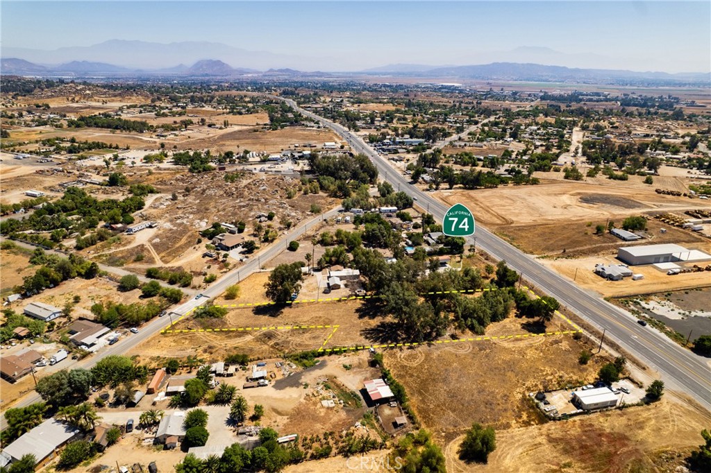 2 Beautiful flat parcels being sold together totalling 1.78 Acres with 165 feet frontage on Highway 74 and 85 feet frontage on Mountain! Zoned by the County for Business Park Commercial, but you can build a home, have a manufacture home or two, or build a business, or both! It is a very good investment PERIOD to hold or build. It is in the path of development, if you check with the county they are turning all Highway 74 in Perris Commercial, we are priced competitively! Our parcels are already Budiness Park Commercial, but homes or farms/ranches still allowed!