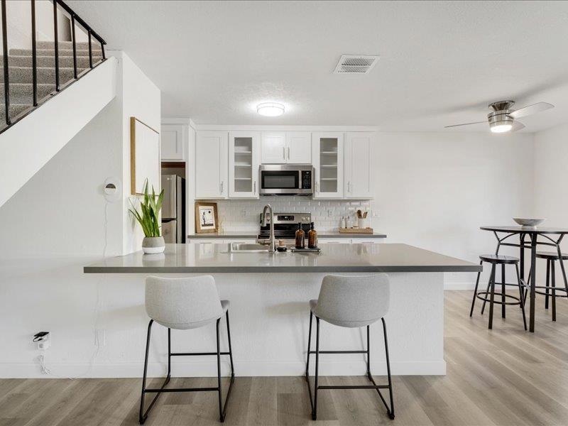 Welcome to Capitola Shores where coastal charm meets everyday convenience. This beautifully updated condo shines with a newly remodeled kitchen and bath, new windows throughout, a new heater, luxury plank flooring, abundant natural light, and a fresh coastal-inspired palette. Designer touches include quartz counters, soft-close cabinetry, bar seating, and a pantry closet perfect for cooking and entertaining. Upstairs, two serene bedrooms offer peaceful retreats after a day by the coast. Live the lifestyle where your car becomes optionalwalk, bike, or surf your way through the day. Perfectly situated between Capitola Village and Pleasure Point, you're just steps from Jade Street Park, community sports courts, and minutes to The Hook, Verve Coffee, New Leaf, Whole Foods, or a sweet treat at Busy Bees Cafe. Enjoy covered parking with secure storage for boards, bikes, and beach gear, plus access to a sparkling pool, picnic area, and well-maintained grounds. Even better a brand-new roof will be installed by November 2025. Whether as a primary home, vacation escape, or investment, this condo checks all the boxes. Welcome home to Capitola Shores.