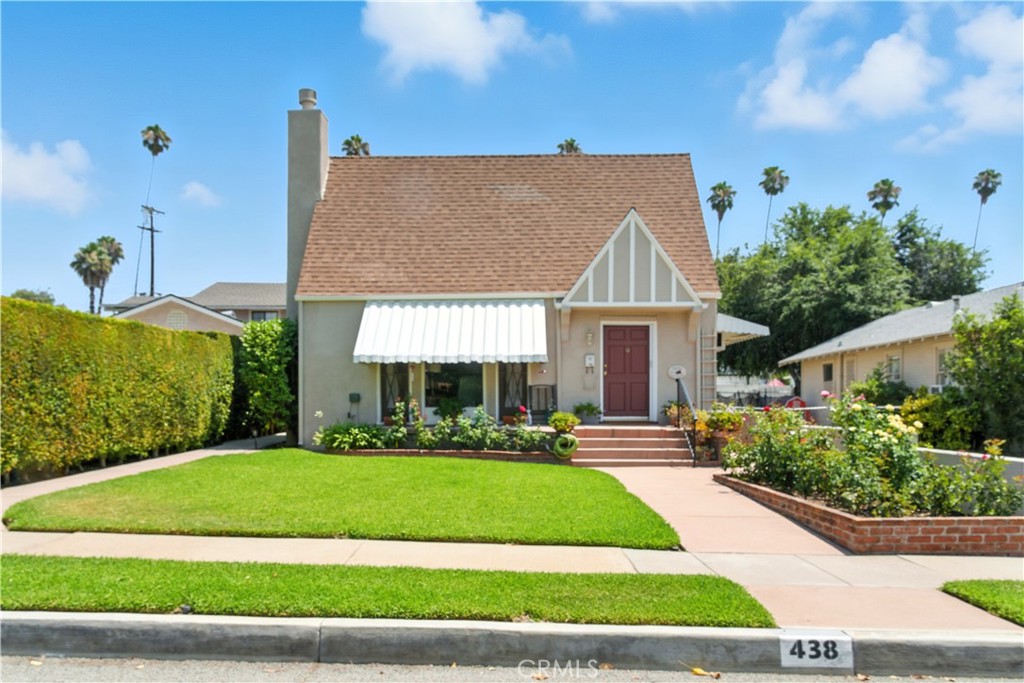 Tucked at the base of the San Gabriel Mountains, this 1934 charmer mixes the character of classic architecture with the confidence of modern updates. Framed by roses and lush hedges, its steep gables and diamond-pane windows set the stage for what’s inside. The main house has 2 comfortable bedrooms, 1 full bath, and bright, welcoming living areas. You’ll find original hardwood floors, a brick fireplace, built-ins, and French doors for a touch of vintage charm, along with peace-of-mind upgrades like fresh paint inside and out, new carpet, waterproof vinyl plank flooring, all-new copper plumbing, a new gas line, and complete electrical rewiring. The kitchen keeps its original cabinetry but adds quartz counters, a matching backsplash, and a new dishwasher for everyday convenience. Above the living room, a pitched-roof attic offers 300+ sq. ft. of storage or creative space. A simple layout change could connect directly to the attached ADU, creating a 3-bedroom, 2-bath home with minimal effort. The rebuilt ADU (2015) is fully self-contained with a modern kitchen, updated appliances, fresh finishes, energy-efficient windows, and beautiful mountain views ideal for guests, rental income, or multi-gen living. Thoughtful touches include built-in USB-C charging ports in the kitchen, adding extra convenience for today’s devices.
One side of the detached garage houses a professionally built, sound-treated media studio originally designed as a detached living room extension for the ADU. It is wired with 8 outlets for a wall-mounted TV and peripherals, plus coaxial cable and high-speed internet connections in both the studio and the adjacent control/ante room. The other garage bay can serve as a workshop or gym, and both areas include additional attic storage. The backyard is low-maintenance with full paving, tall hedges, a mature lemon tree, and a garden strip for herbs or veggies. All of this is just minutes from downtown Glendora, parks, schools, and shopping.