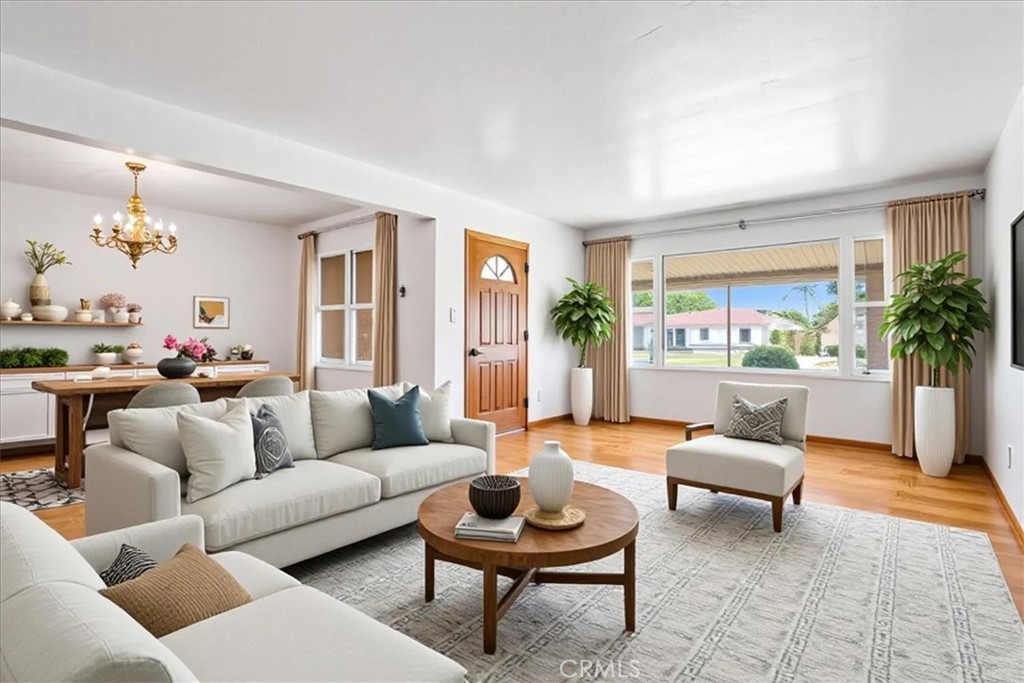 Don’t miss this rare opportunity to own a spacious, single-story corner lot—on the market for the first time in over 50 years! Lovingly maintained by its original owner, this home has just been painted and features beautifully refinished original hardwood floors. Updates include a newer roof and water heater.
The oversized lot offers excellent ADU potential and is filled with mature fruit trees including avocado, orange, tangerine, and citrus. Outdoor features include a charming pavilion, a stamped concrete pad, and a large grassy area—perfect for relaxation or entertaining.
Inside, you’ll find 3 bedrooms and 2 bathrooms, a generously sized kitchen with a dining nook, and an open-concept living and dining area filled with natural light—ideal for everyday living and hosting guests. Both bathrooms feature step-in showers, and one bedroom includes built-in shelves and drawers. The direct-access 2-car garage offers ample storage space, a washer/dryer hookup, and a utility sink. There’s also plenty of parking available in the driveway.
Ideally situated between the 5 and 805 freeways, just minutes from shopping, dining, and entertainment.
(Some Photos are virtually staged -- they are labeled and the original photos are next to each staged photo).