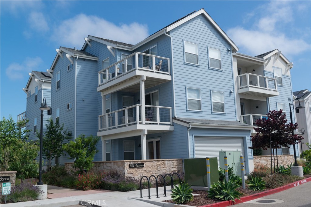 Modern Luxury with scenic views in San Luis Ranch - Enjoy upscale, eco-conscious living in this move-in-ready, second-story condo located in San Luis Obispo’s desirable San Luis Ranch community. Built in 2022, this solar-powered (solar is owner owned), all-electric 3-bedroom, 2-bathroom home offers panoramic views of the Seven Sisters and Laguna Lake. The open-concept floor plan is filled with natural light and features high-end finishes, central air conditioning, and in-unit stackable laundry. The kitchen and living areas are ideal for entertaining, while the spacious primary suite includes a beautifully designed en-suite bath. Two additional bedrooms provide flexible space for guests, a home office, or family use. The guest bathroom includes a tub/shower combo with modern design touches. Community amenities include a resort-style pool and spa, clubhouse, and secure bike garages. Located just minutes from parks, hiking and biking trails, shopping centers, Cal Poly, and the beach, this home offers both convenience and lifestyle. Live steps away from Costco, Target, Sprouts, Ulta, and local dining at SLO Ranch. With thoughtful design, sustainability, and unbeatable location, this condo offers the best of modern living in San Luis Obispo. Welcome home!