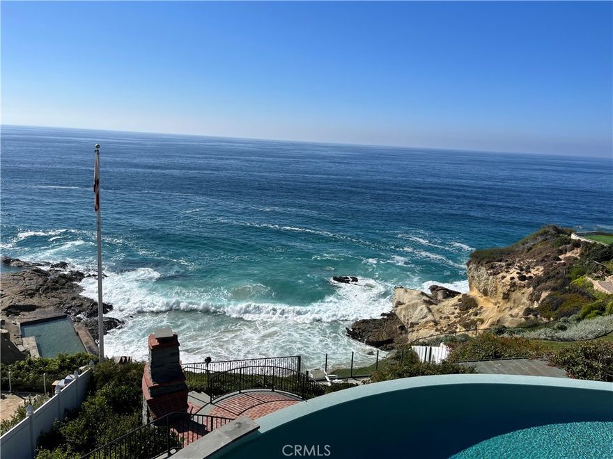 Experience the pinnacle of coastal living at this magnificent OCEAN FRONT gem in THREE ARCH BAY! Perched majestically above a secluded cove, this timeless Cape Cod residence beckons with its breathtaking white water vistas, mesmerizing sunsets, and the tranquility of North La Senda Drive.    Entertain in style in the expansive dining room, unwind in the spacious living room, and channel your inner chef in the charming cook's kitchen featuring a walk-in pantry, a massive marble island, and a state-of-the-art Le Corneau range. Throughout the rest of the home, tasteful and comfortable furnishings guarantee a refreshing and pristine experience during your vacation stay.

But the real magic happens outdoors! Step out to the top-tier infinity pool for unparalleled relaxation, then descend to the dining deck for a meal by the outdoor fireplace. Continue your journey a few steps further to the glass-enclosed lounge area with your toes in the sand, complete with a fire pit and inviting Adirondack chairs—the idyllic spot to culminate a day at the beach!

Indulge in THREE ARCH BAY's resort-style amenities, including a private beach, volleyball, tennis and basketball courts, a tot-lot, and the peace of mind provided by round-the-clock guard-gated security. Positioned between The Montage Resort and The Ritz Carlton, this prime location offers a front-row seat to the best of coastal living. Don't miss Laguna's cultural icons like the Pageant of the Masters, Art-A-Fair, and the renowned Sawdust Festival. Explore Laguna's pristine coastline with surfing, boogie boarding, and stand-up paddle boarding, or venture to nearby Dana Point Harbor for whale watching and jet-skiing adventures. Welcome to a beachfront haven where every day is a celebration of luxury, leisure, and the allure of the sea!