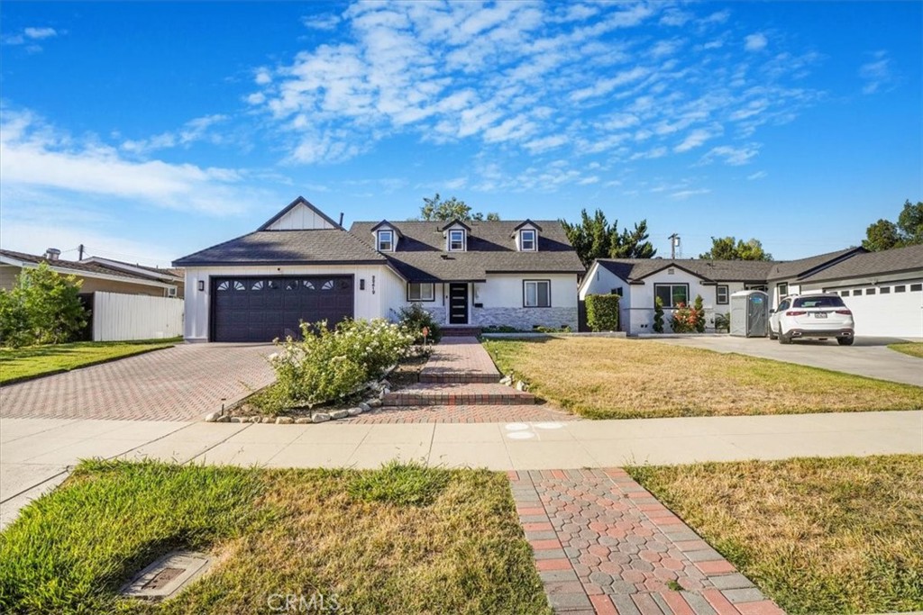 Gorgeous 2 story home located in the heart of West Hills. Pavestone driveway leading to an attached 2 car garage, lush landscaping and recently painted creates the ideal curb appeal This spacious home features an open floor plan, including a large living room and family room with vaulted ceilings. Newer laminated floors throughout home except tile in bathrooms. The custom kitchen boasts quartz countertops, custom cabinets, and newer stainless-steel appliances, including a range oven, and dishwasher. This home features an open-concept layout perfect for entertaining and everyday living. The spacious living and dining areas flow seamlessly, highlighted by designer finishes throughout with newer windows and sliding doors. The family room features a cozy gas burning fireplace. Spacious 2 Bedrooms and Bathroom in first floor and 2 Bedrooms and 1 bathroom in second floor providing ample space for luxurious living. The backyard is landscaped with white gravel, pavestone and Patio with wooden deck, creating a low-maintenance and stylish outdoor space. Newer epoxy flooring in garage. Discover the perfect blend of comfort and convenience! Located near schools, parks, eateries and so much more!! A must-see!