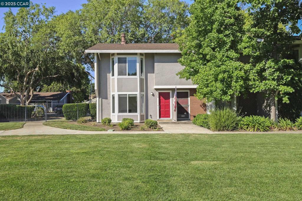 Welcome to this inviting end-unit townhome that's perfectly situated on the Concord/Walnut Creek border, offering the ideal blend of convenience and community living. Located in the sought-after Cherrywood neighborhood, this home provides easy access to top-rated schools, shopping, dining, parks, and BART for a stress-free commute. Inside, discover a spacious and light-filled layout featuring a comfortable living room with a wood-burning fireplace and expansive windows that create a warm, welcoming atmosphere. The remodeled kitchen boasts stainless steel appliances, stone countertops, and abundant storage, opening to a dining area with sliding glass doors that lead to your private enclosed patio to detached garage. Perfect for relaxing or entertaining! Convenient laundry hookups are located in the main-level half bath. Upstairs, you’ll find a bright guest bedroom with a walk-in closet, a full hallway bath, and a serene primary suite with an attached bathroom. Recent updates include a newly replaced garage man door, and new dual paned-windows throughout. Enjoy Cherrywood’s wonderful amenities, including a community pool, tennis courts, and open green space. This home offers comfort, functionality, and an unbeatable location in one exceptional package. Come see!