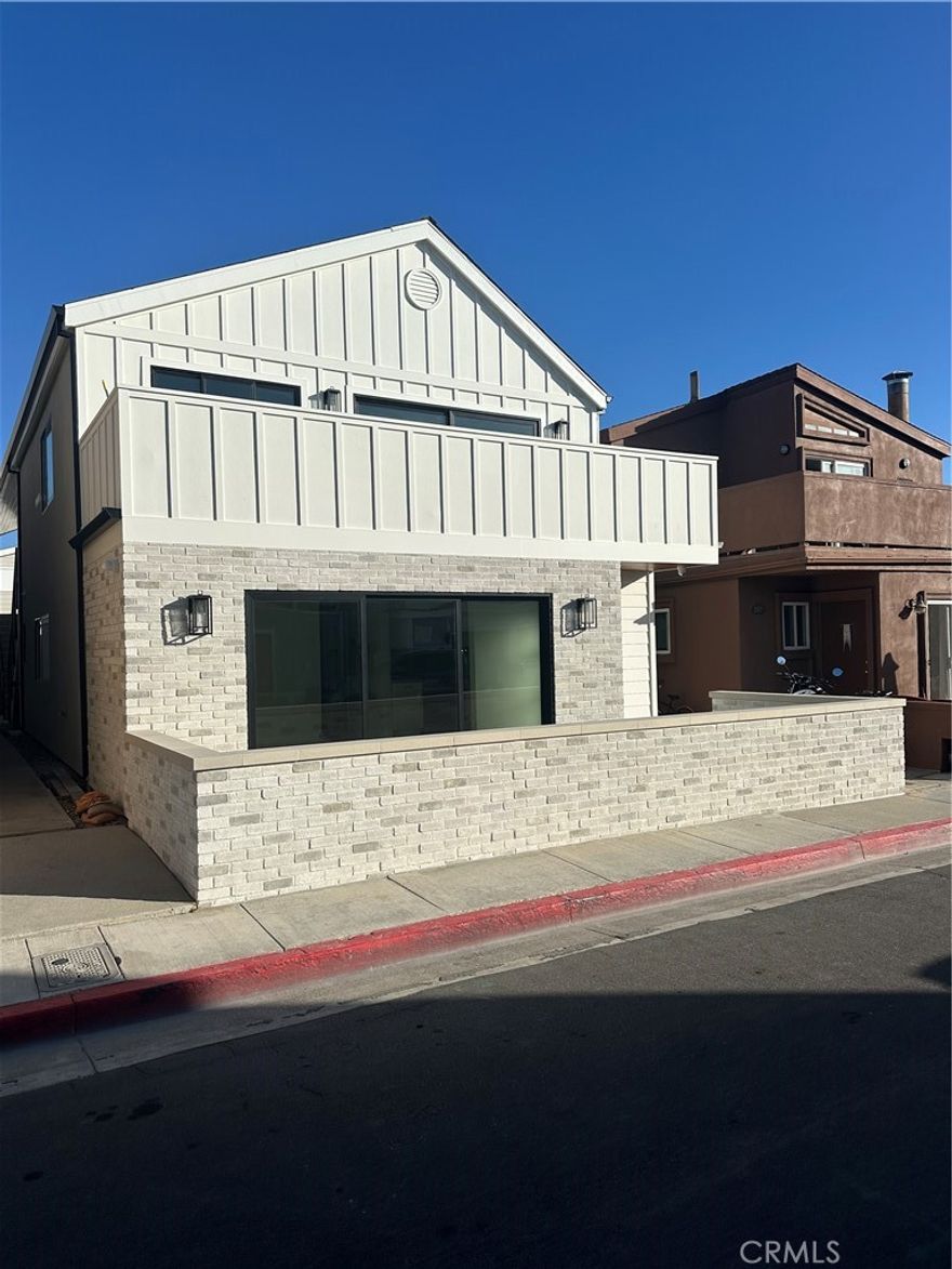 Experience coastal living and be the first one to live in this brand new 2Br/2Ba unit with all the amenities. Completely remodeled interior and exterior.  Fully air-conditioned. All new appliances including stove, microwave, dishwasher and refrigerator.  Quartz counter tops in kitchen and bathrooms.  Quartz walls in bath shower/tubs.  Mirrored wardrobes with custom closet organizers. Luxury vinyl plank flooring and porcelain tile baths. Vaulted ceilings.  In garage washer/dryer hookups.  Doubled-paned windows.  Includes two car parking in garage with dedicated electric car charger outlet.  Private garage cabinet.  Private front patio.  Security features including locking mailboxes and Ring doorbell. Across the street from ocean.  Non-Smokers only.  In the finishing stages of construction.  Ready for move-in Nov. 1 to Nov. 15.