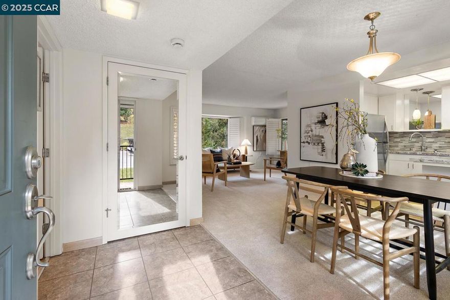 Lovely Del Monte condo nestled in the treetops in the active-adult community of Rossmoor. This upstairs end-unit has a serene setting from almost every window and is located in a small entry with only one other building for ultimate privacy. Inside this charming one bedroom/one bathroom home you'll find a redesigned layout with a dramatic double-door entry to the generously sized bedroom and additional sought-after storage space added to the cozy Living Room. The Kitchen has been updated with a modern glass subway tile backsplash, stone counters, decorator light fixtures, and stainless steel appliances. With both a breakfast bar at the Kitchen island, and a spacious Dining Area, you have multiple options for light meals at home or family gatherings at the dinner table. An updated vanity in the bath matches perfectly with the shoji screen detailing at the large stall shower and laundry closet with a convenient stacked washer/dryer. The property is in pristine move-in condition with new carpet and fresh paint throughout and is ready for you to make it your own. You'll appreciate additional desirable features like the plantation shutters and a mini-split system for instant A/C and heat. Carport with storage just steps away from the home.