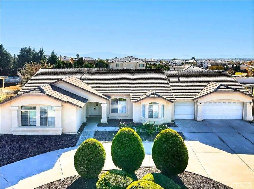 Welcome to this spacious 3,048 sq. ft. single-story ranch home situated on an expansive 18,025 sq. ft. lot, offering a highly functional layout and incredible potential. All bedrooms are located on one side of the home, featuring three large secondary bedrooms and an over sized primary suite with a sliding door to the backyard. The primary bathroom includes a separate tub and shower, dual-sink vanity, private toilet room, a generous walk-in closet within the bathroom area, plus an additional closet in the bedroom.

The bedroom wing also includes a guest powder room and a full bath. Multiple living spaces include a large living room and a spacious family room that share a dual-sided fireplace, along with a formal dining area. The kitchen is exceptionally large with abundant cabinetry, a center island, pantry, and a generous dining area. Four sliding glass doors throughout the home offer great natural light and a seamless indoor/outdoor flow.

A huge bonus room with its own attached bathroom sits on the opposite side of the home—ideal for multi generational living, a private guest suite, home office, gym, or creative space. Additional features include an individual laundry room and a four-car garage with a workshop area and a pass-through to the backyard.

The expansive backyard features a pool, horseshoe pit, and plenty of room to customize. This single-story ranch home sits on a large horseshoe driveway lot and includes solar for added energy efficiency. A wonderful opportunity to make this home your own.