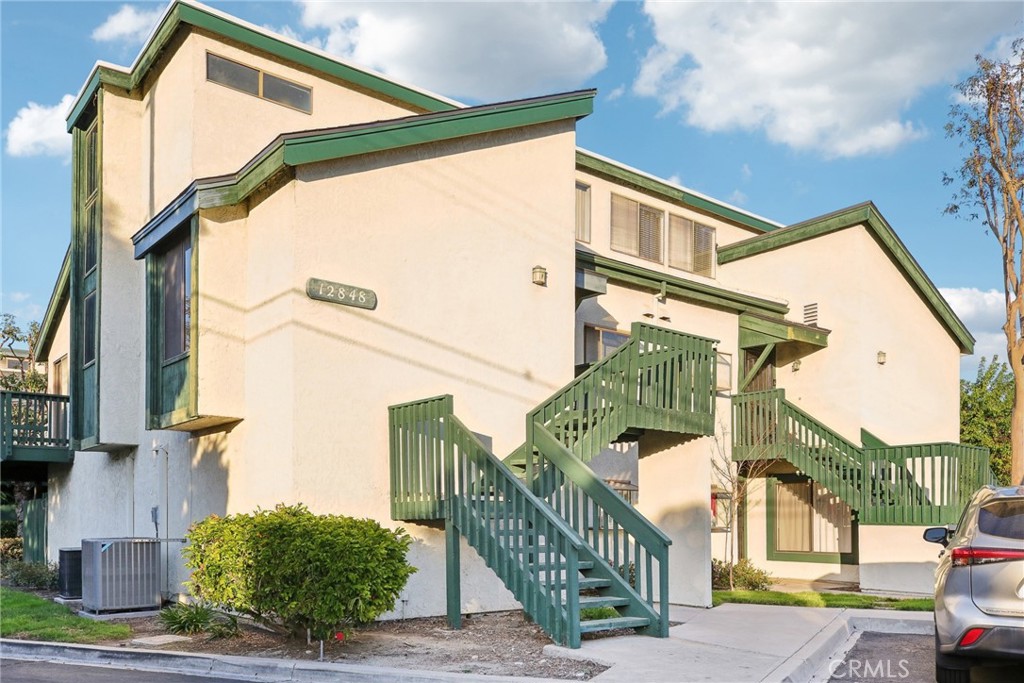 Move in ready 2 bedroom, 2 bath lower level, END UNIT condo with only one shared wall in a GATED COMMUNITY with LOTS OF GUEST PARKING. The condo comes with IN UNIT LAUNDRY, CENTRAL AIR, TWO DETACHED GARAGE RIGHT OUTSIDE THE UNIT, AND WATER PAID for by HOA all for $560,000. Tucked into a residential neighborhood, this condo is a part of the Greenhouse West gated community. Featuring a spacious floor plan, with laminate flooring and stone countertops in the kitchen. Enjoy the convenience of in-unit laundry and step outside to your large private patio, perfect for relaxing or entertaining. One of the standout features of this unit is the detached two-car garage—a rare find in this community! Take advantage of amenities, including a pool, spa, lots of guest parking, and well-maintained common areas, with water, trash, and garage electricity covered by the HOA. Ideally located near Disneyland, major freeways, shopping centers like The Outlets at Orange, and top medical facilities like UCI Medical Center, this home offers easy access to everything you need.