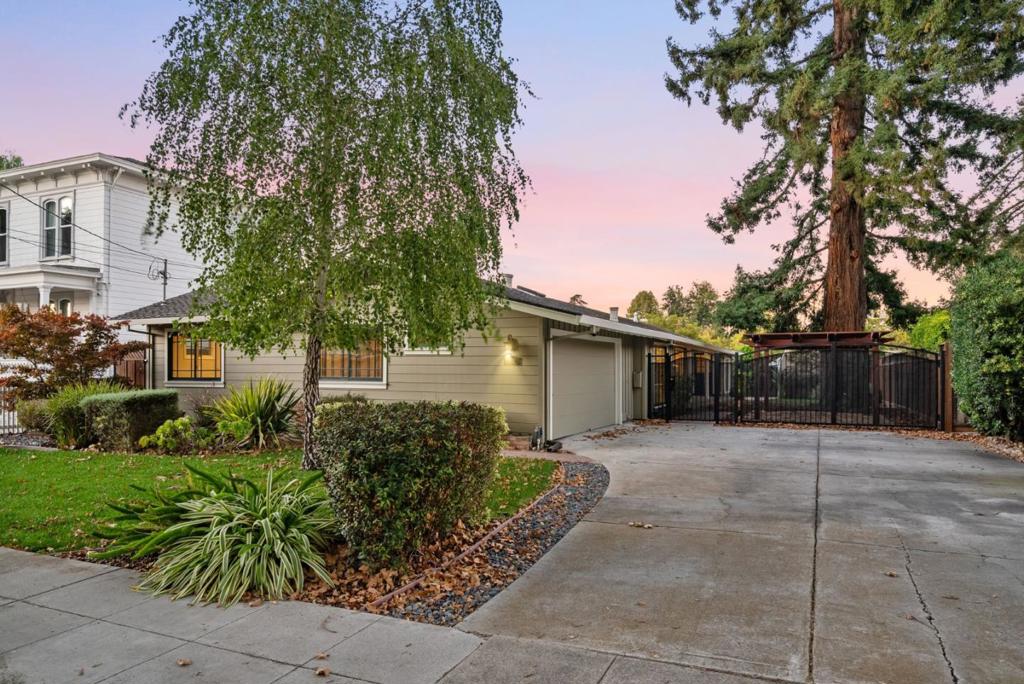 A move-in ready retreat on an uncommonly private 9,600sf lot along one of the widest and most coveted tree-lined streets in all of San Jose in the Chapman-Morse pocket of the greater Rose Garden neighborhood, surrounded by natural beauty and historic homes yet built more recently to more modern code and construction standards. Life slows down when you cross through the gate and step through the east-facing entrance into the focal point of the home, a more than 40-foot-wide vaulted great room, featuring an open chefs kitchen with Viking appliances (including a commercial-grade exhaust hood and 6-burner range) bathed in light through oversized period windows and skylights, which opens onto a covered porch and peaceful shaded courtyard with a pergola above a stone patio. Three spacious bedrooms (all large enough to accommodate king beds) skirt the great room, and one of which could easily be converted to an ensuite, giving the home dual master suites, one at each end of the extended floor plan, ideal for multi-generational living. A generous backyard offers potential for a large office, gym, yoga studio, or for conversion to a detached ADU. The list of interior upgrades includes HVAC, 200-amp electrical, copper piping, hardwood throughout, in-ceiling LED lighting.