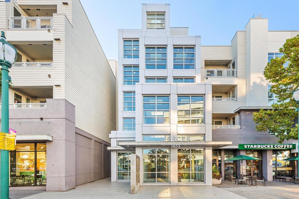 Luxury and convenience meet in this top-floor Mercer condo in the heart of downtown Walnut Creek. With 2 bedrooms and 2 baths across a spacious open layout, this home is filled with natural light through floor-to-ceiling windows and enhanced by higher ceilings exclusive to the 4th floor, modern flooring, and fresh paint. The gourmet kitchen features Sub-Zero and Bosch appliances, stone countertops, and a breakfast bar, flowing seamlessly into the dining and living areas. The primary suite offers a walk-in closet and a spa-inspired bathroom with double vanity, soaking tub, and separate shower. The second bedroom and full bath are ideal for guests, a home office, or both, while the laundry room with side-by-side washer/dryer and cabinetry adds everyday convenience. Step outside to a covered patio overlooking the courtyard, or enjoy resort-style amenities including a pool, spa, gym, clubhouse, and BBQ area. Two side-by-side parking spaces and a storage unit complete the package. All of this just minutes from BART, freeway access, Broadway Plaza shopping, and Walnut Creek’s top dining and cultural destinations. Photos were taken when the home was professionally staged and may not reflect the home’s current appearance.