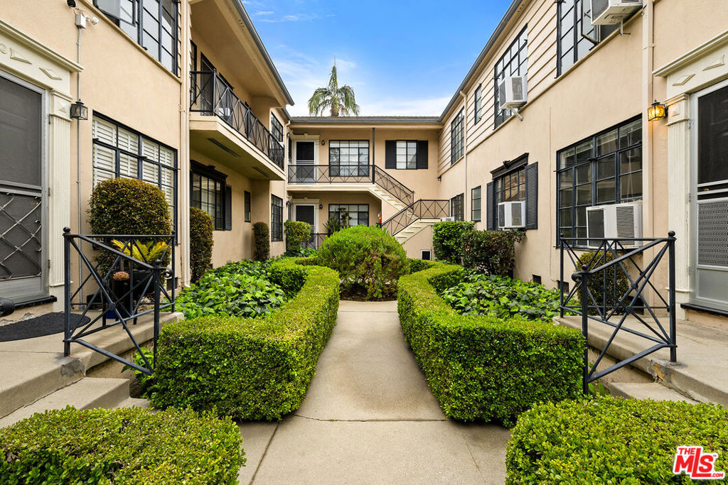 This bright, upper-level 1 bedroom, 1 bathroom home is located in a classic Beverly Hills courtyard building, just steps from the Four Seasons Hotel and Robertson Blvd. The unit features crown molding, modern light fixtures, updated flooring, and plenty of natural light throughout. The spacious living area flows into a charming dining nook off the kitchen, which offers ample cabinet space and includes a convenient secondary entrance for added ease and accessibility. The bathroom is refreshed with a sleek vanity and a full tub/shower combination. Additional perks include one assigned carport parking space, on-site laundry facilities, and water and trash included in rent. Set in an exceptionally convenient location near Cedars-Sinai, the Beverly Center, The Ivy, Alfred Coffee, and a variety of popular dining, shopping, and entertainment destinations.