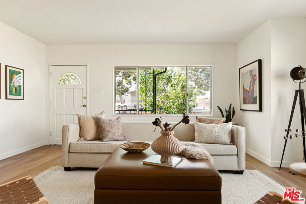 Think owning a home in Los Angeles is out of reach? Think again.Welcome to El Sereno, a neighborhood that feels like home the moment you arrive. This sweet bungalow sits on a quiet street, right across from one of the area's great schools, and it's ready to be the start of your story. Inside, sunshine pours into the oversized living room, a perfect spot for movie nights, game days, or just kicking back after work. Fresh light oak laminate floors flow through the home, making the space feel open and airy. You've got three cozy bedrooms, one full and one three-quarter bath, and a roomy kitchen where you can whip up dinner or gather with friends. Freshly painted inside and out, this home is move-in ready with not much left to do. And the lot? A generous 7,400 square feet that's just begging for your ideas. Add a garden, build an ADU, host BBQs or garden parties...you name it. Close to the Eastern Corridor, you'll have everything you need just minutes away. You know what? I think your search might be over.