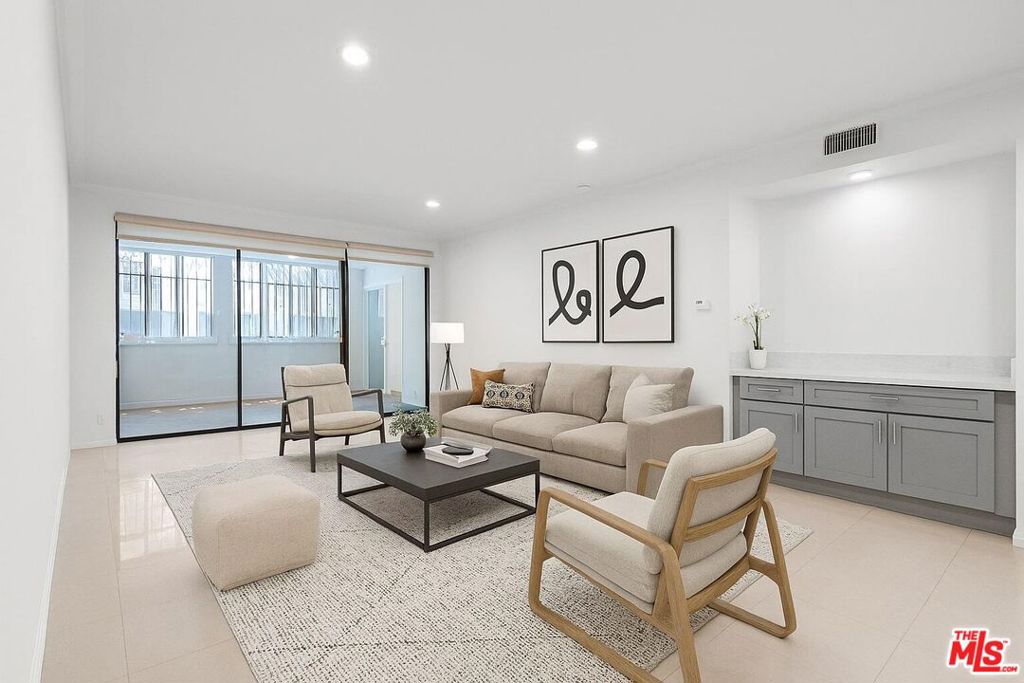 Experience modern living in this fully renovated, move-in ready condo in the heart of Los Angeles. Unit 106 features a smart, spacious layout with two generously sized bedrooms positioned on opposite sides of the expansive living room each with its own full bathroom offering privacy and flexibility for shared living or guests. The entire unit has been thoughtfully upgraded with brand new recessed lighting, sleek tile flooring, and high ceilings that create an open and airy atmosphere.The kitchen has been completely remodeled with stylish new cabinetry, quartz countertops, a modern faucet, and a full set of brand-new appliances including refrigerator, dishwasher, oven, microwave, and in-unit washer and dryer. The enclosed balcony offers an extended living area perfect for a home office, workout space, or reading nook. Both bedrooms offer ample closet space and comfort, making this home as functional as it is beautiful. Located in a secure, well-maintained community with controlled access, a pool and spa, fitness center, and guest parking. Comes with two assigned parking spaces.Enjoy unbeatable convenience with close proximity to Korea-town, Downtown LA, Beverly Hills, and a variety of dining, shopping, and entertainment options just minutes away.