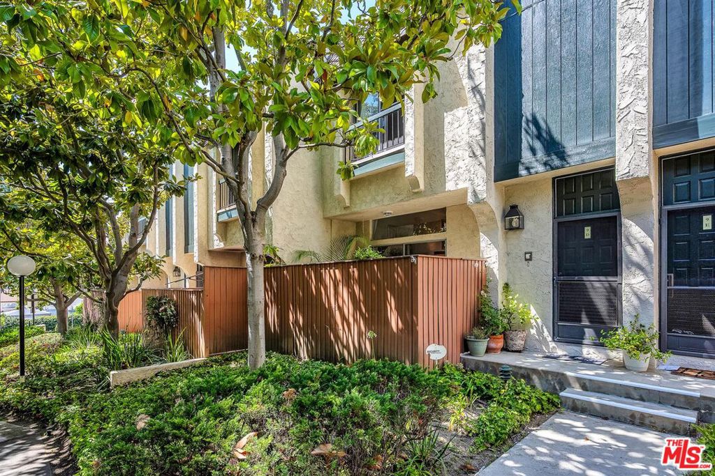 Welcome to Beverlywood West one of Culver City's most desirable townhome communities! This light-filled 3-Bedroom, 2.5-Bath residence blends comfort, privacy, and prime location in one of the best spots in the complex. Unit 9D lives like a single-family home with a direct-access 2-car garage and a private patio ideal for outdoor Dining, Entertaining, or relaxing with a morning coffee. Step inside to a spacious Living room with soaring ceilings, a cozy Fireplace, and abundant natural light. The stylish open-concept layout seamlessly connects the Kitchen, Dining area, and Living space perfect for Modern living. The Gourmet Kitchen features a large center island, generous cabinetry, new stove, and an adjacent Laundry room with side-by-side washer and dryer. Upstairs, you'll find three generous Bedrooms including a Primary suite with dual closets and a private ensuite Bath. Enjoy tree top views from the Master suite. Enjoy access to resort-style amenities including two sparkling pools, spa, sauna, tennis and volleyball courts, a playground, clubhouse, and lushly landscaped grounds. HOA dues include Spectrum cable/internet, earthquake insurance, on-site security, and more. Don't miss this chance to own in a thriving, community-oriented neighborhood!
