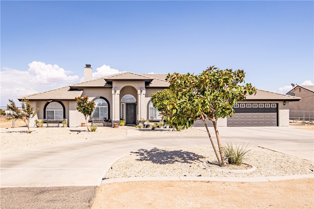 This stunning 2-acre property features a large circular driveway and a grand entrance to a 2,623 sq ft home with an open floor plan and an upgraded kitchen. Boasting 4 spacious bedrooms, 2 bathrooms, and a 3-car attached garage, this home offers ample space for both comfort and convenience. RV parking is available on both sides of the home. As you step inside, you’ll be greeted by beautiful tile flooring, a formal dining room, and a spacious living area with vaulted ceilings that create a bright, airy atmosphere. The living room is highlighted by a gorgeous stone fireplace with built-in shelving for books and storage. The kitchen is a chef’s dream with stainless steel appliances, granite countertops, a large center island, glass backsplash, and a generous pantry. Adjacent to the kitchen is a cozy breakfast nook. The master bath features dual sinks, a Jacuzzi tub, and stylish overhead lighting that spans across the vanity area. Throughout the home, no detail has been overlooked, with high-quality vinyl shutters and ceiling fans in every bedroom. The backyard is perfect for relaxation, featuring a covered patio and a cross-fenced area with trees along the fence line. There’s also ample space in the back of the property to build an additional dwelling unit (ADU), offering great potential for expansion. Don’t miss out on this exceptional opportunity—it won’t last long!